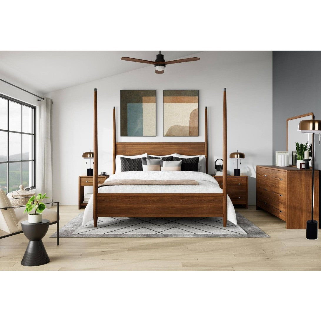 Modern bedroom with wooden four-poster bed, nightstands, dresser, and large windows.