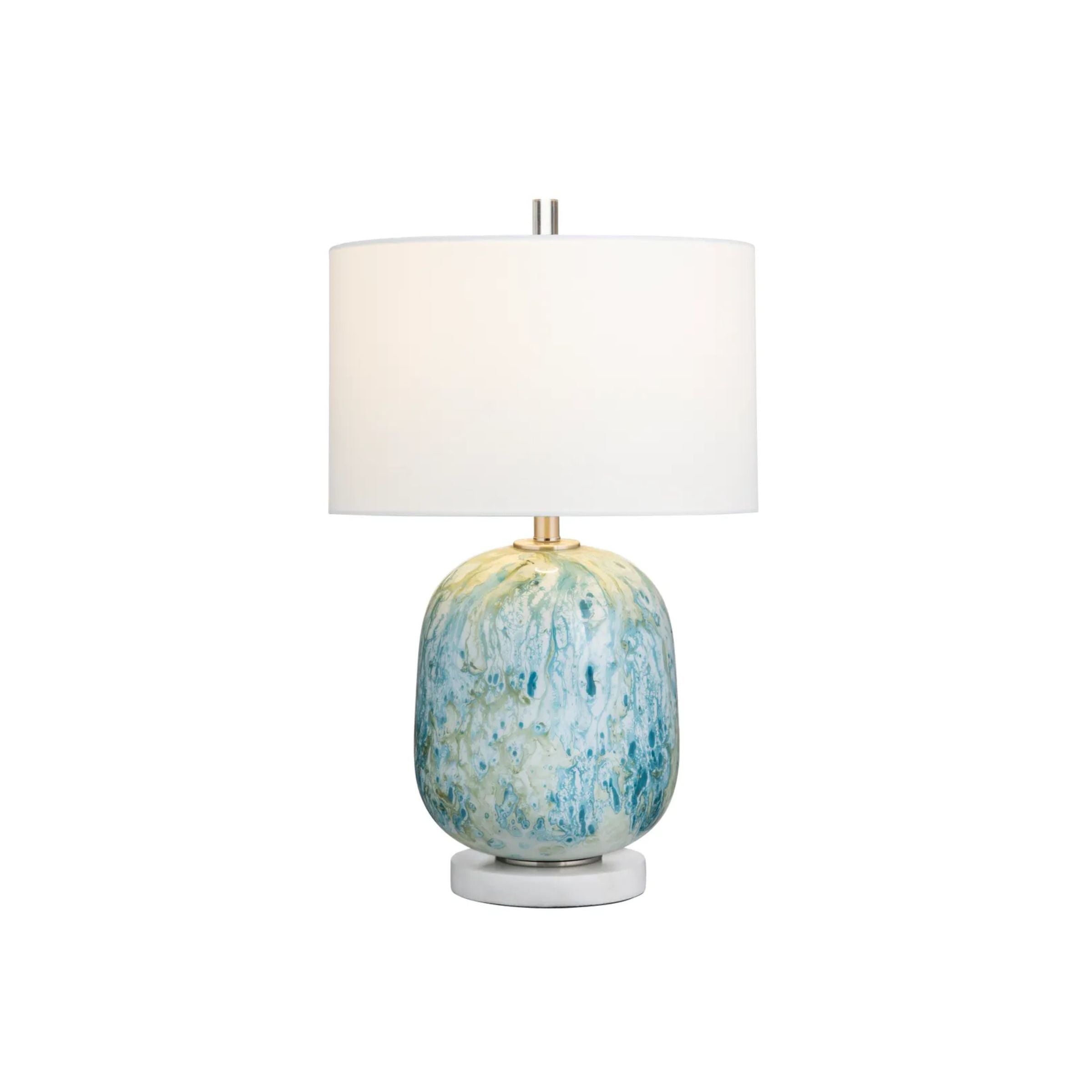 Table lamp with a white shade and blue-green ceramic base.