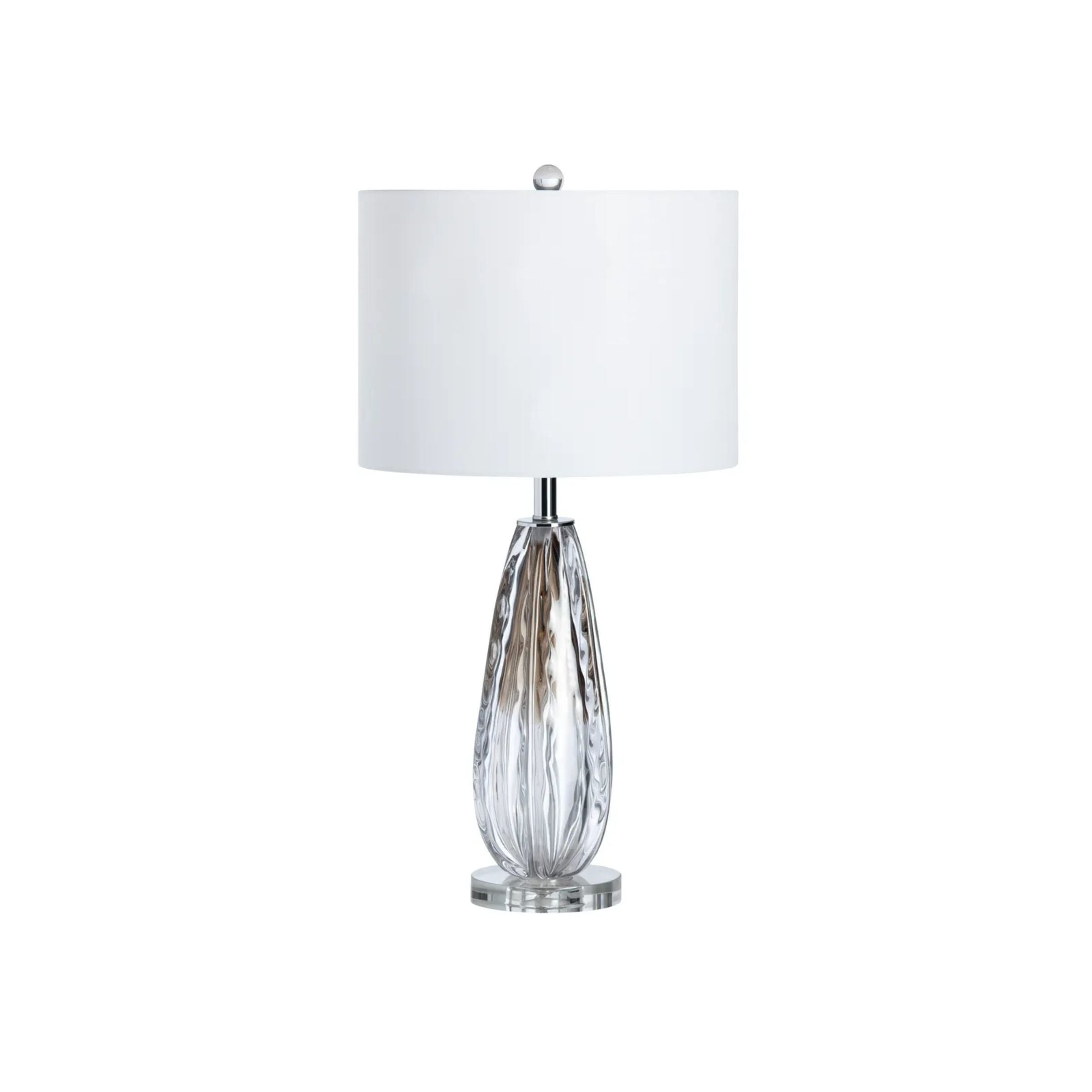 Clear glass table lamp with white drum shade.
