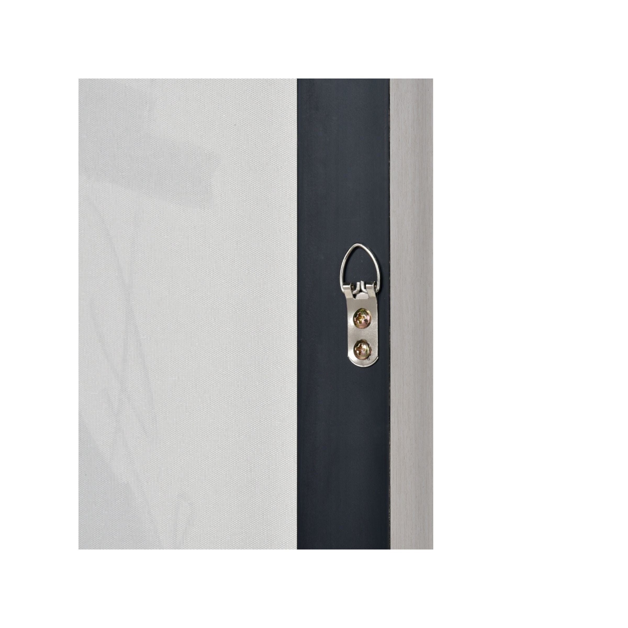 Closeup of a picture frame hanger on the backside for wall mounting.