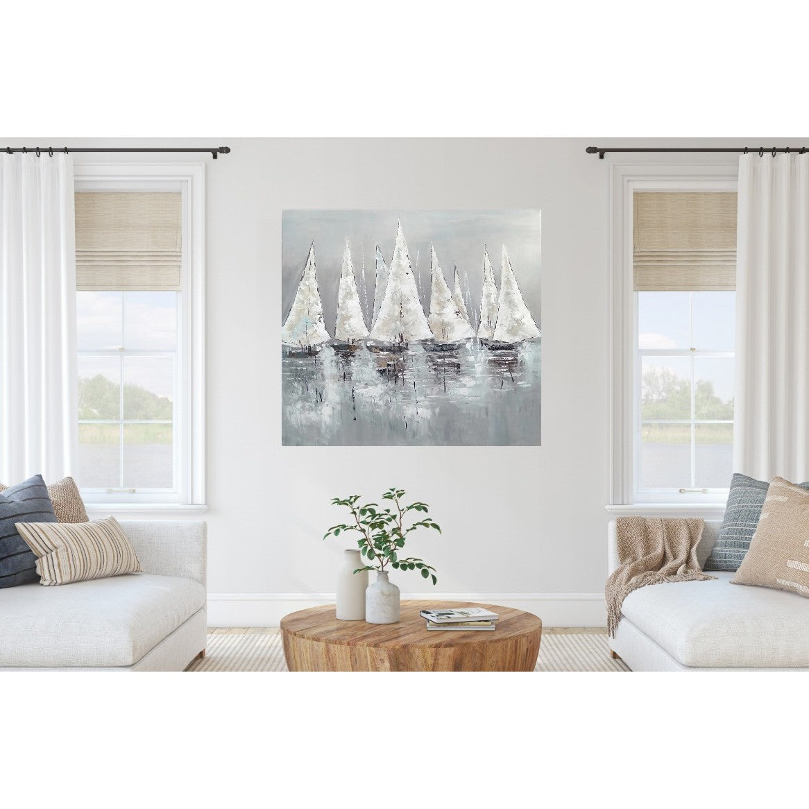 Abstract painting of sailboats on water displayed in a bright, modern living room.