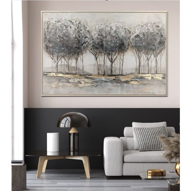 Modern living room with neutral sofa, black table, and abstract tree artwork on the wall.