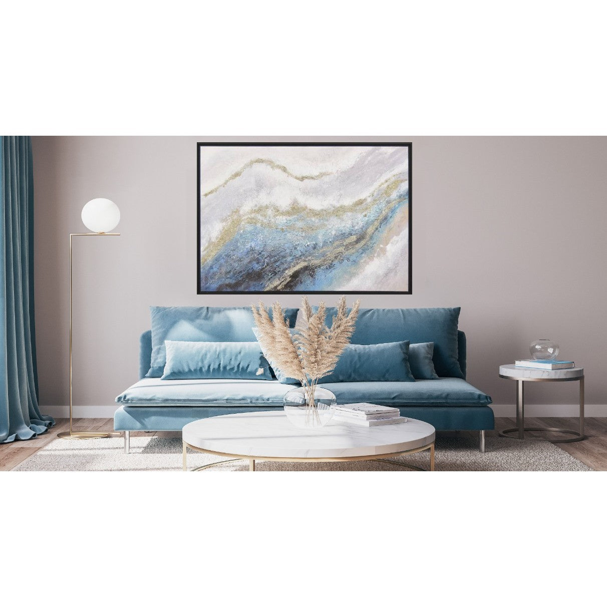 Abstract painting with blue and gold tones above a blue sofa in a modern living room.