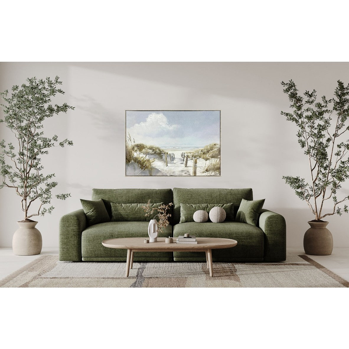 Living room with green sofa, coffee table, two potted plants, and a beach painting on the wall.