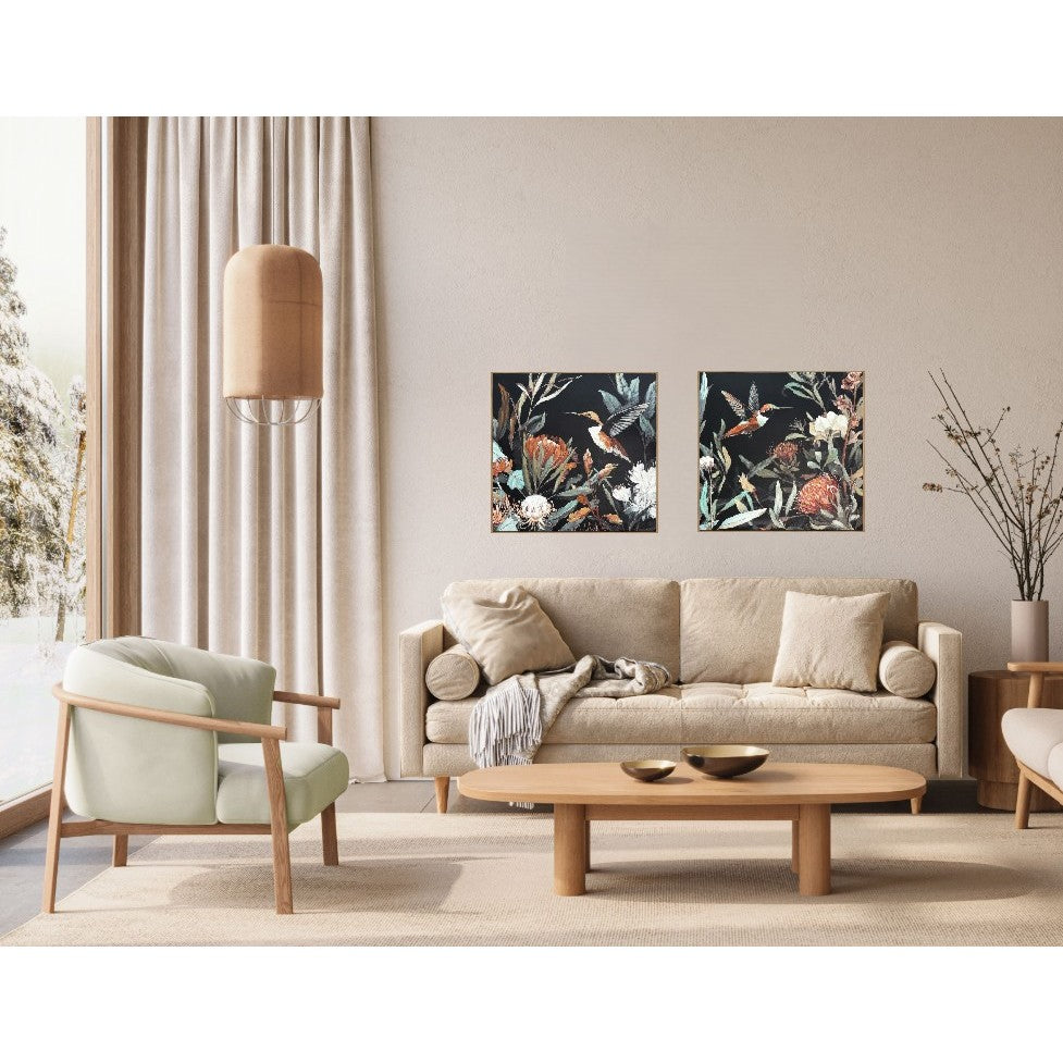 Modern living room with neutral furniture and two floral bird art pieces on the wall.