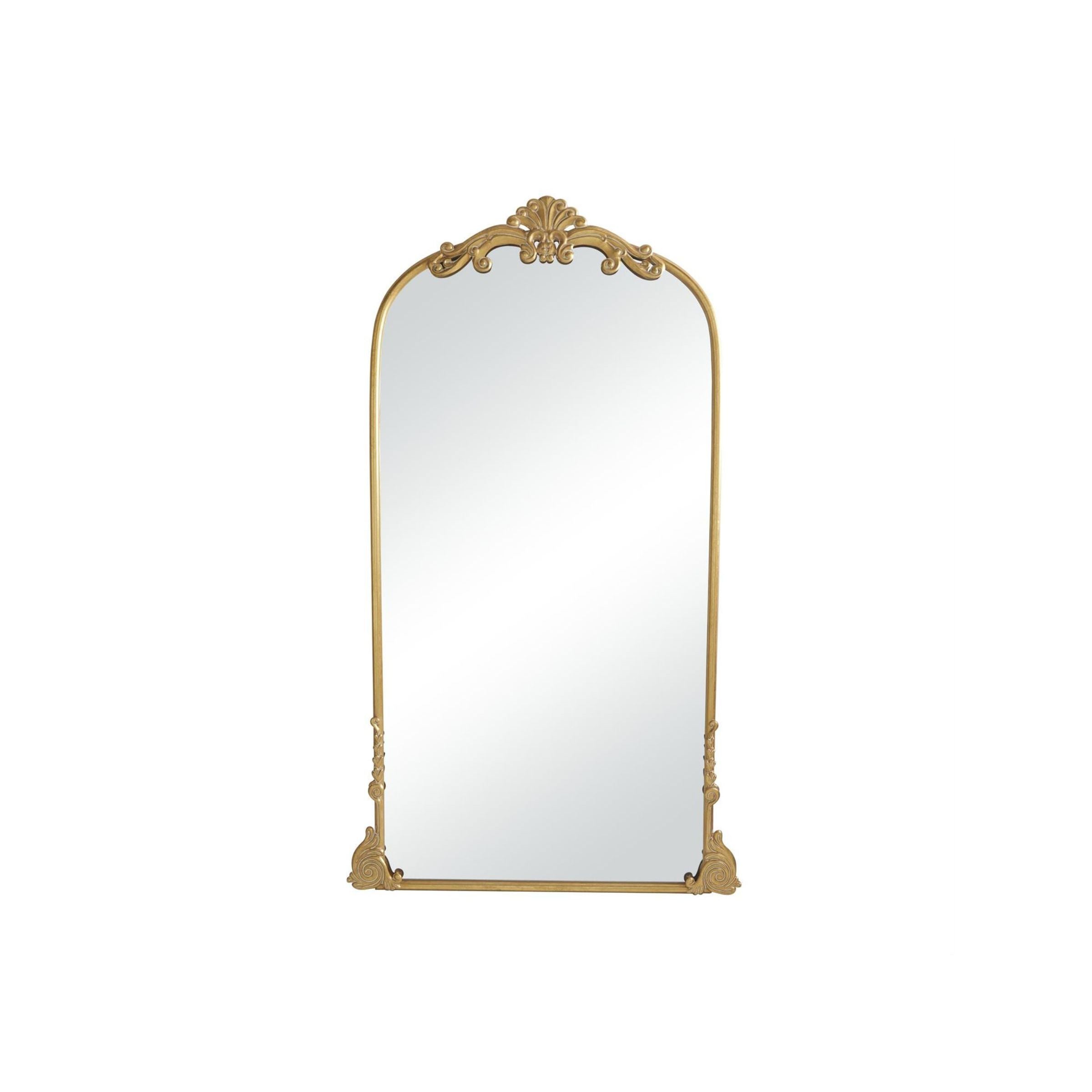Arched gold-framed mirror with ornate detailing at the top and corners.