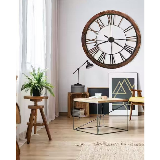 Modern living room with large wall clock, mid-century furniture, and geometric artwork.