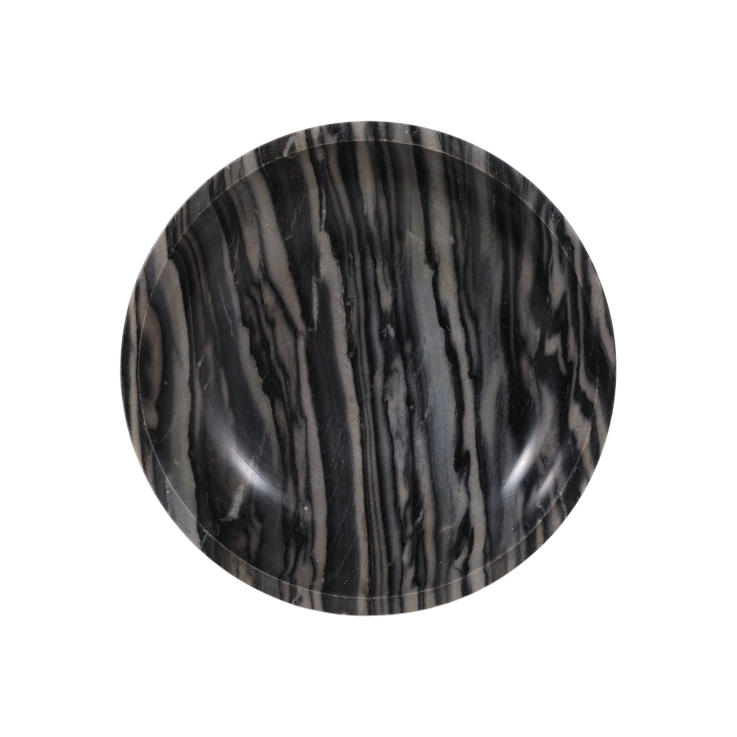 Round black and gray marbled plate, top view.