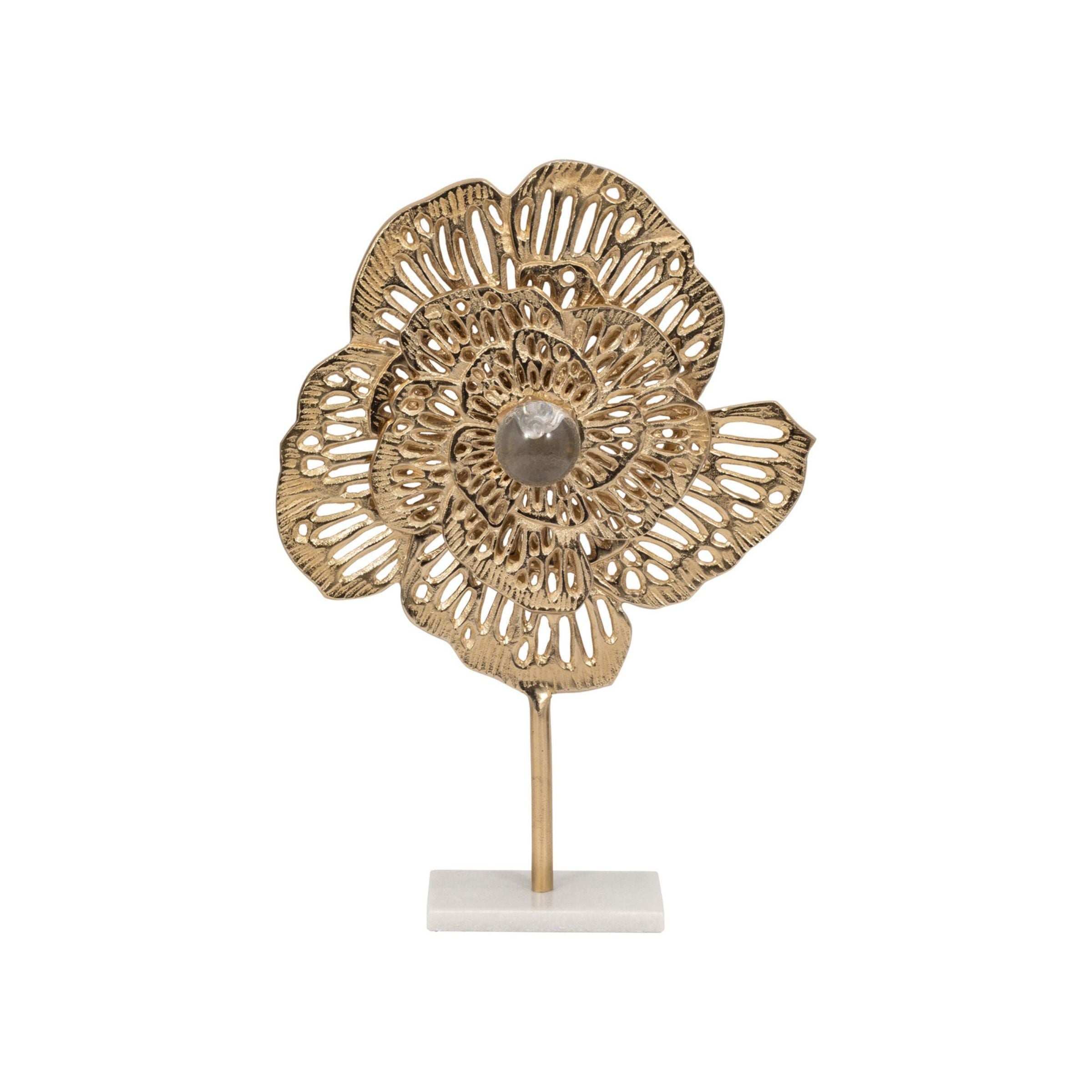 Gold metal flower sculpture on a stand, decorative accent for home or office.