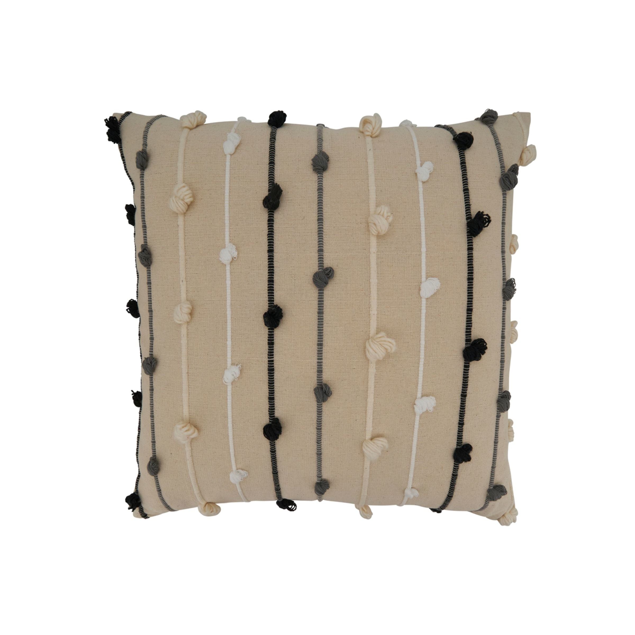 Beige throw pillow with vertical lines and textured knots in white, gray, and black.