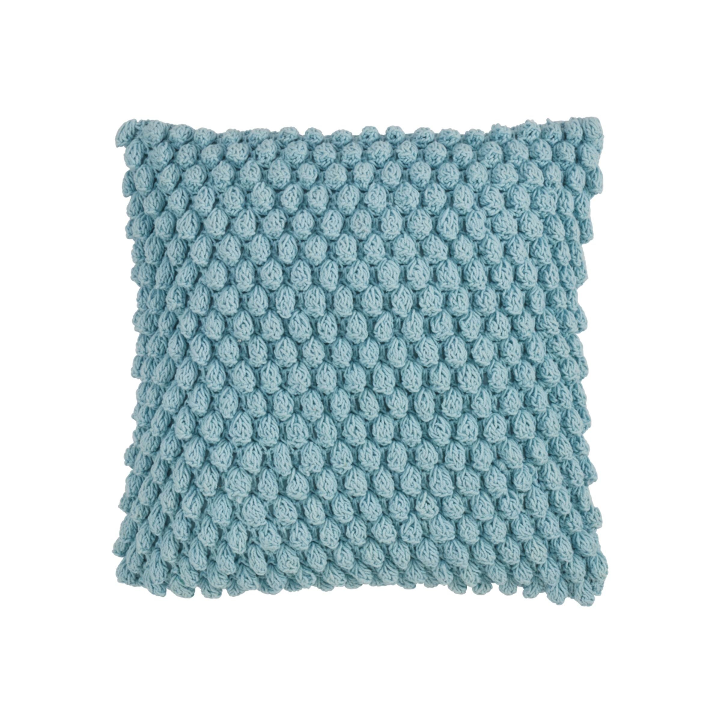 Square blue pillow with a chunky knit bubble texture.