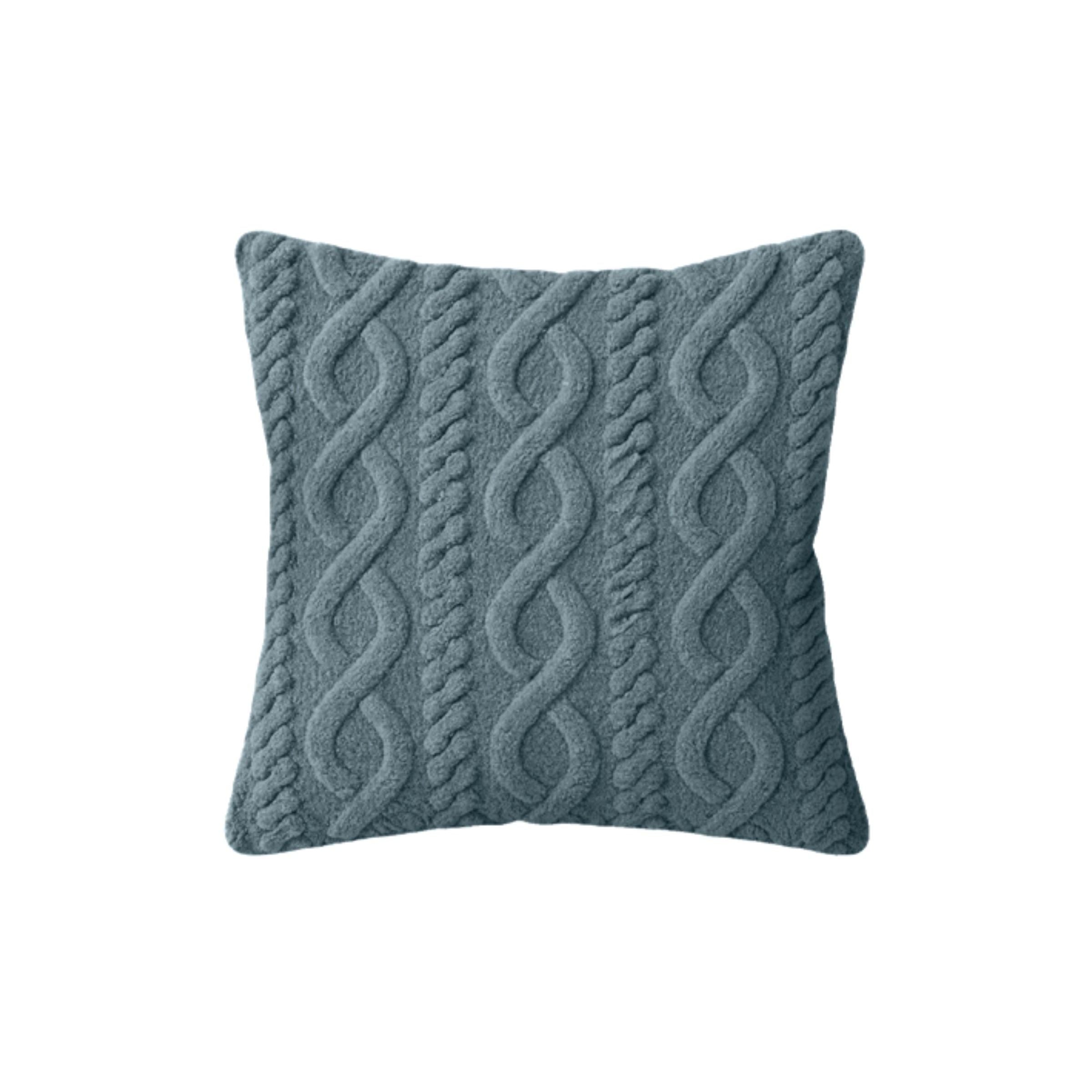Blue knit throw pillow with a raised cable pattern.