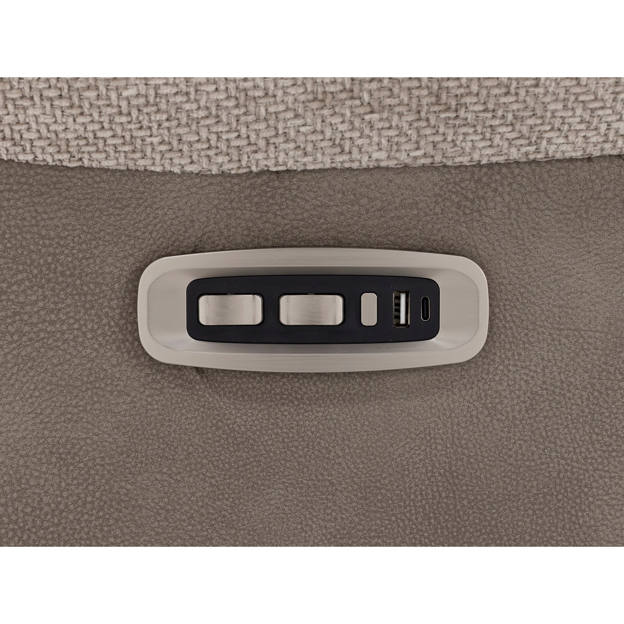 Close-up of recliner control panel with two switches and USB charging ports.