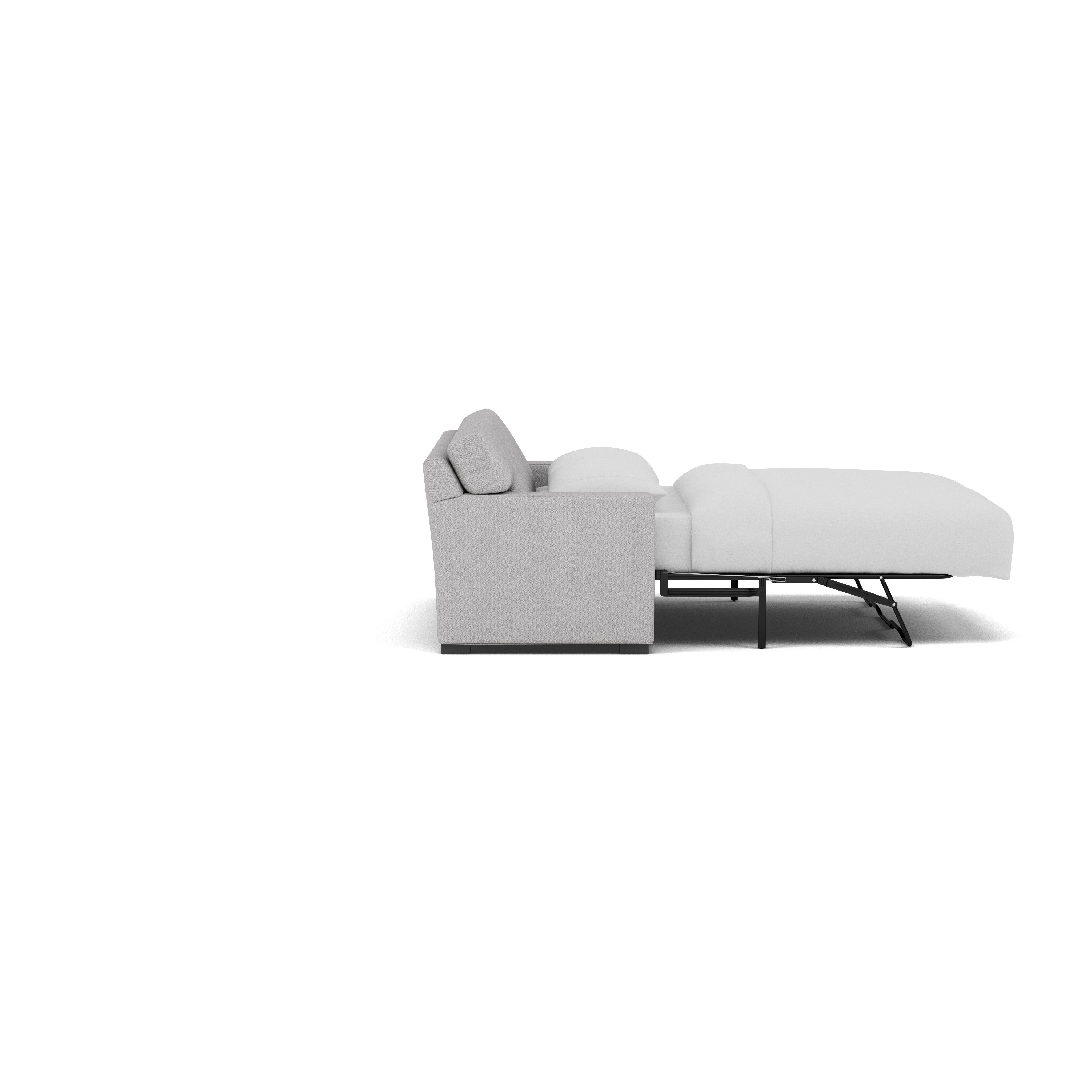 Side view of a light grey sleeper sofa with the bed extended and made with white bedding.