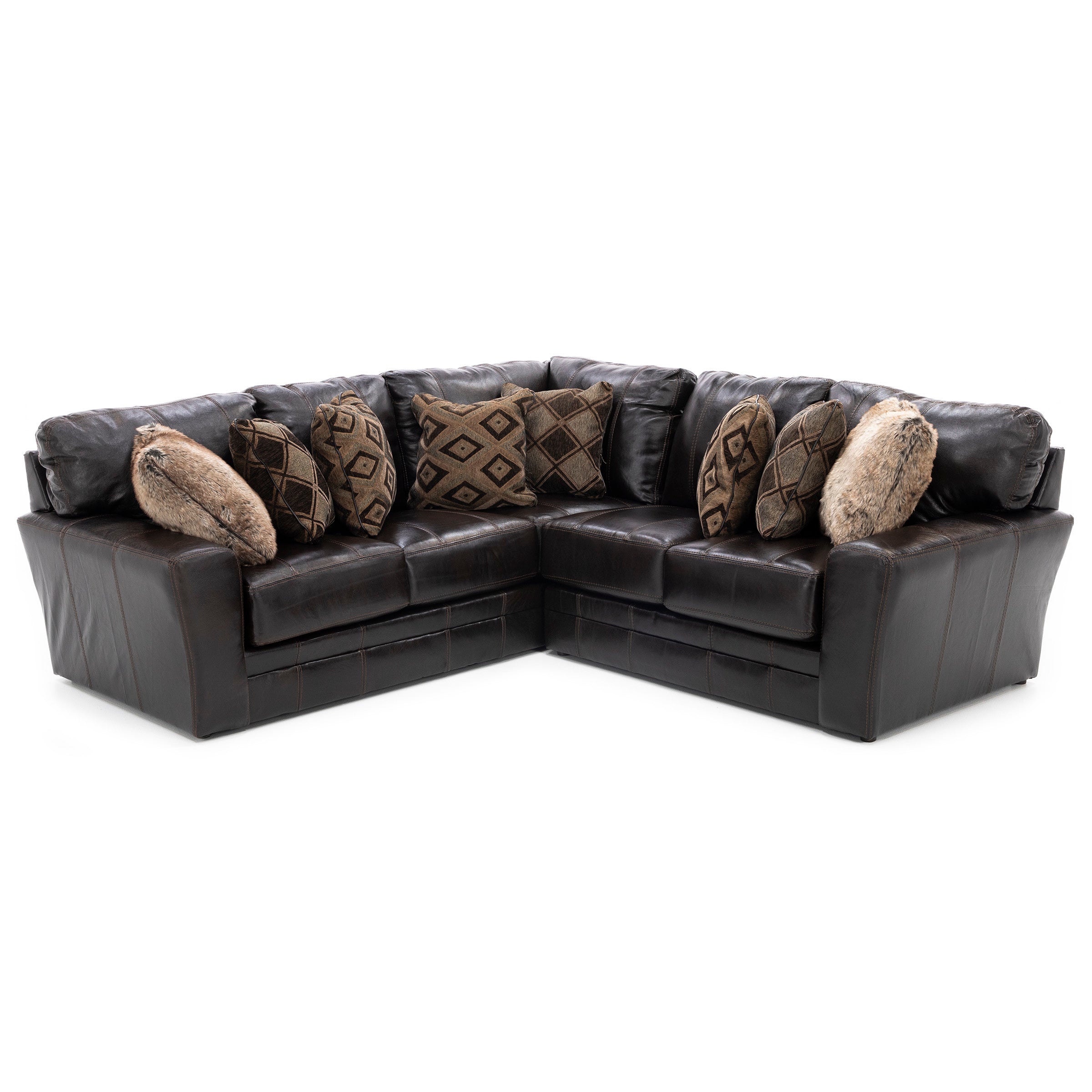 Dark brown leather sectional sofa with patterned and faux fur pillows.