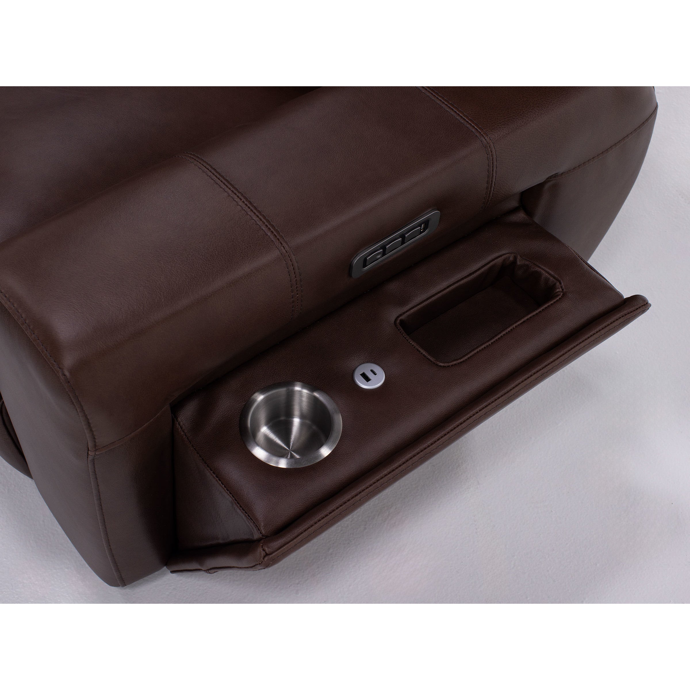 Armrest with cup holder, storage compartment, and power outlet on brown recliner.