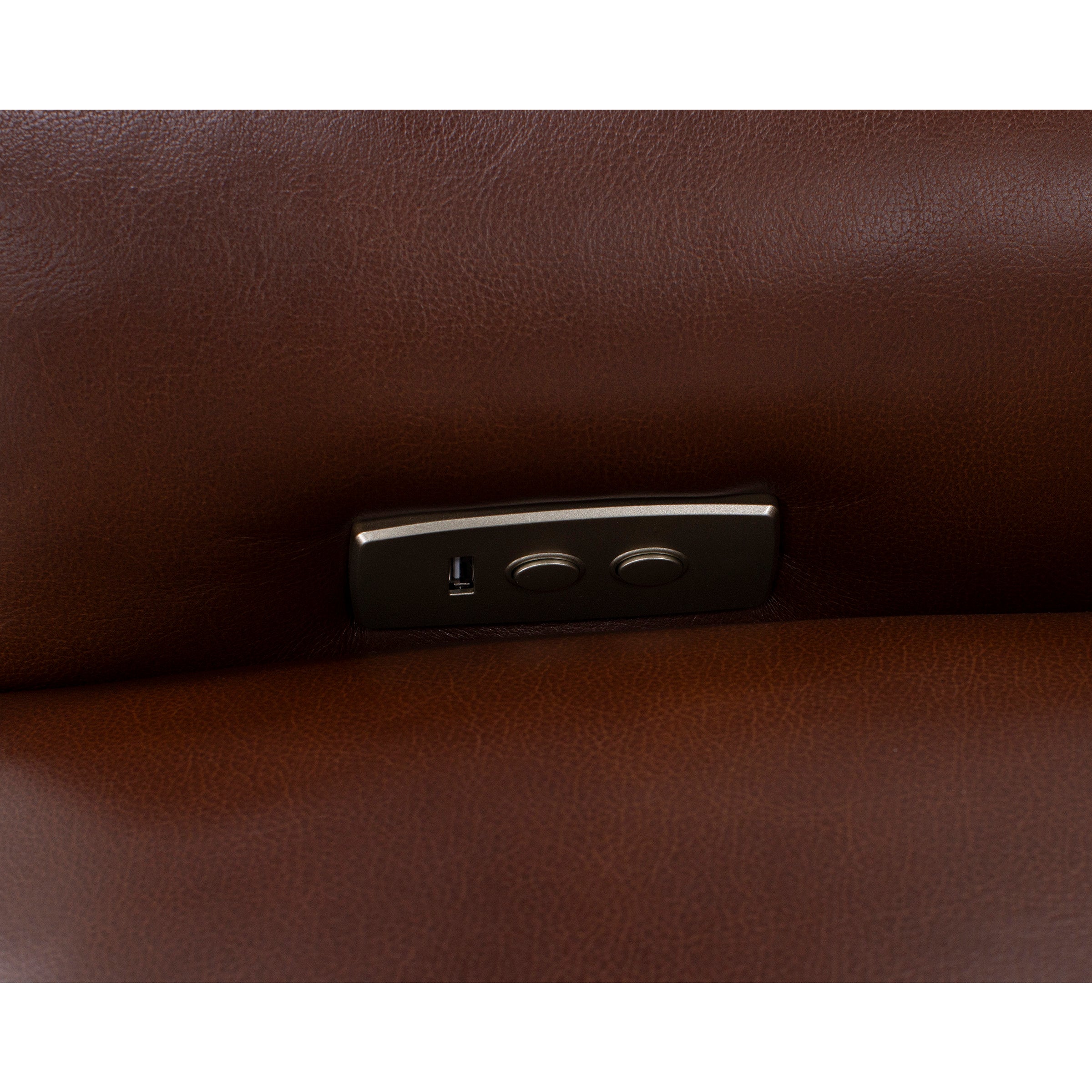 Close-up of brown leather furniture with USB port and control buttons.