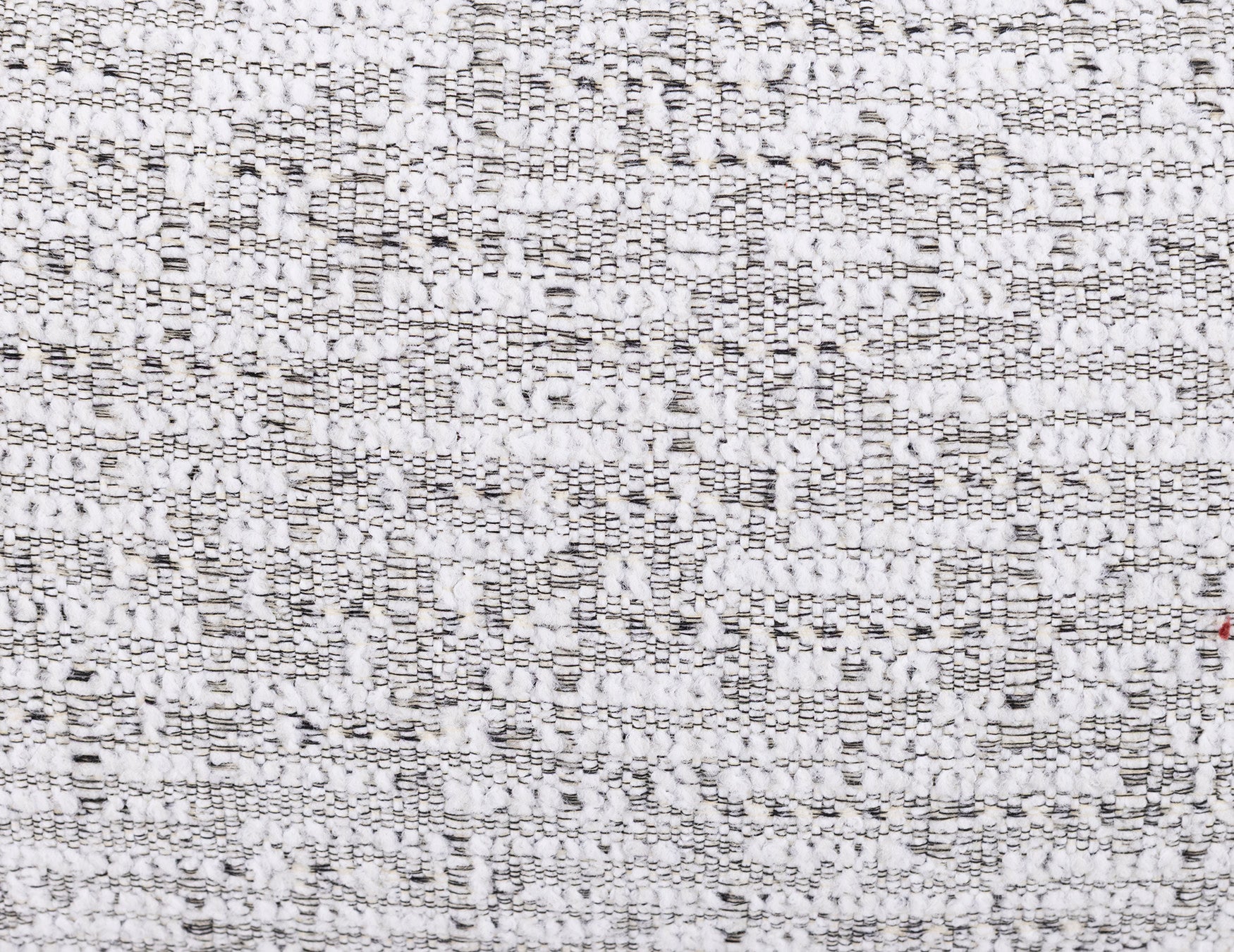 Close-up of white woven fabric texture with subtle black threads.