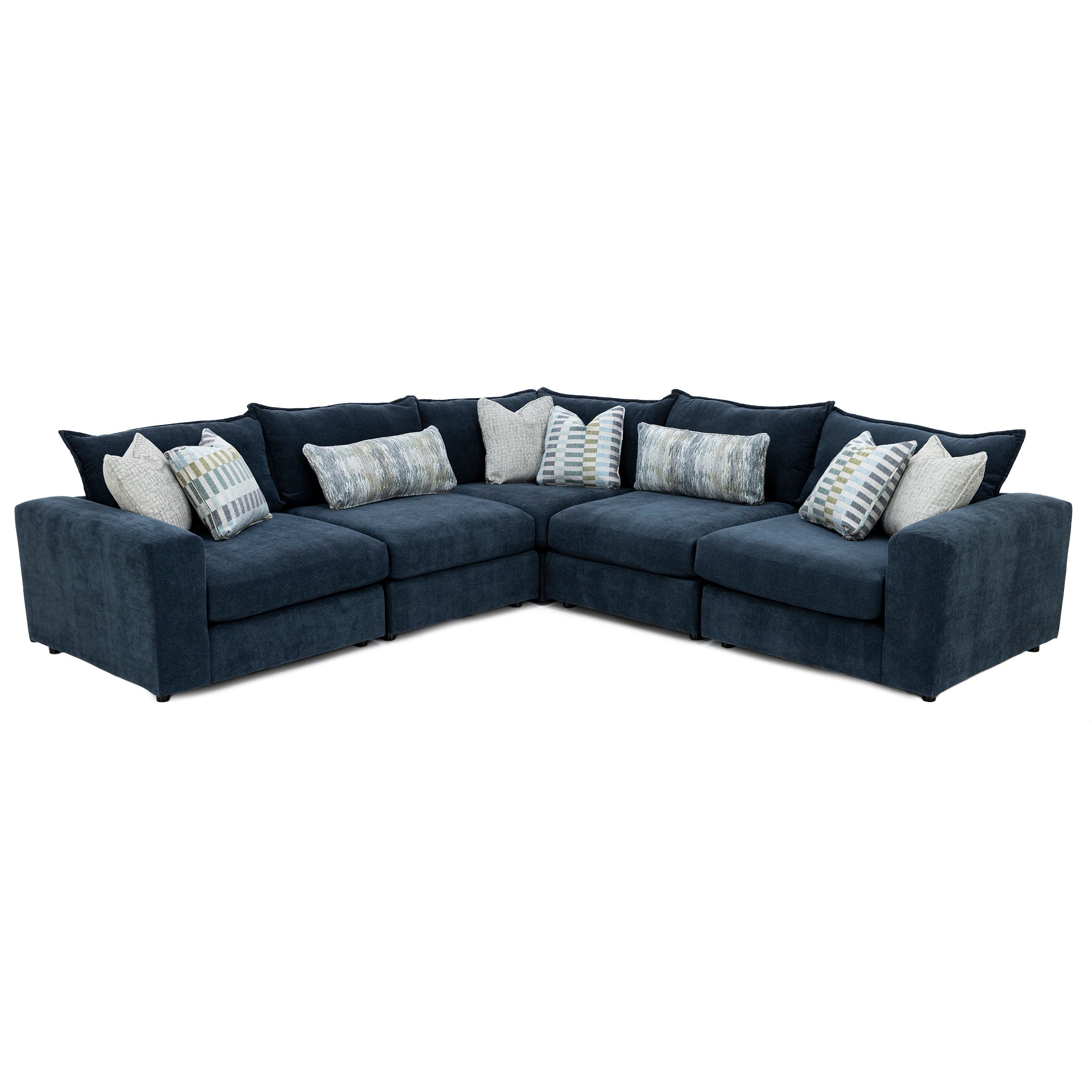 Navy blue sectional sofa with patterned and textured throw pillows.