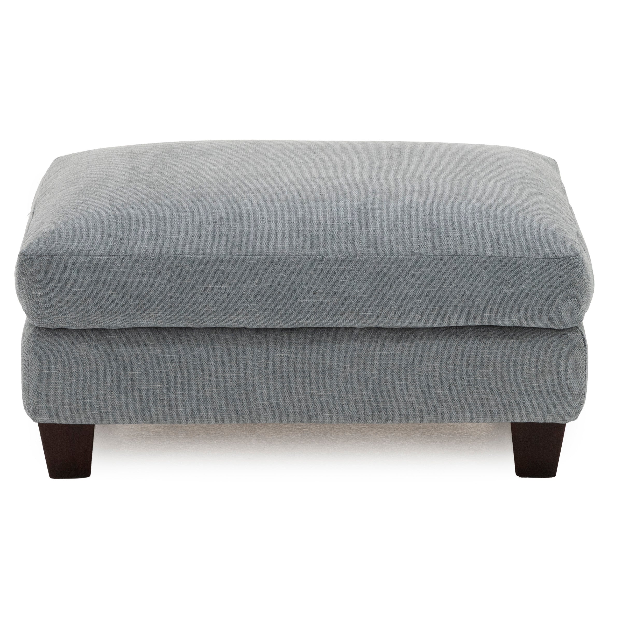 Square gray fabric ottoman with dark wooden legs.