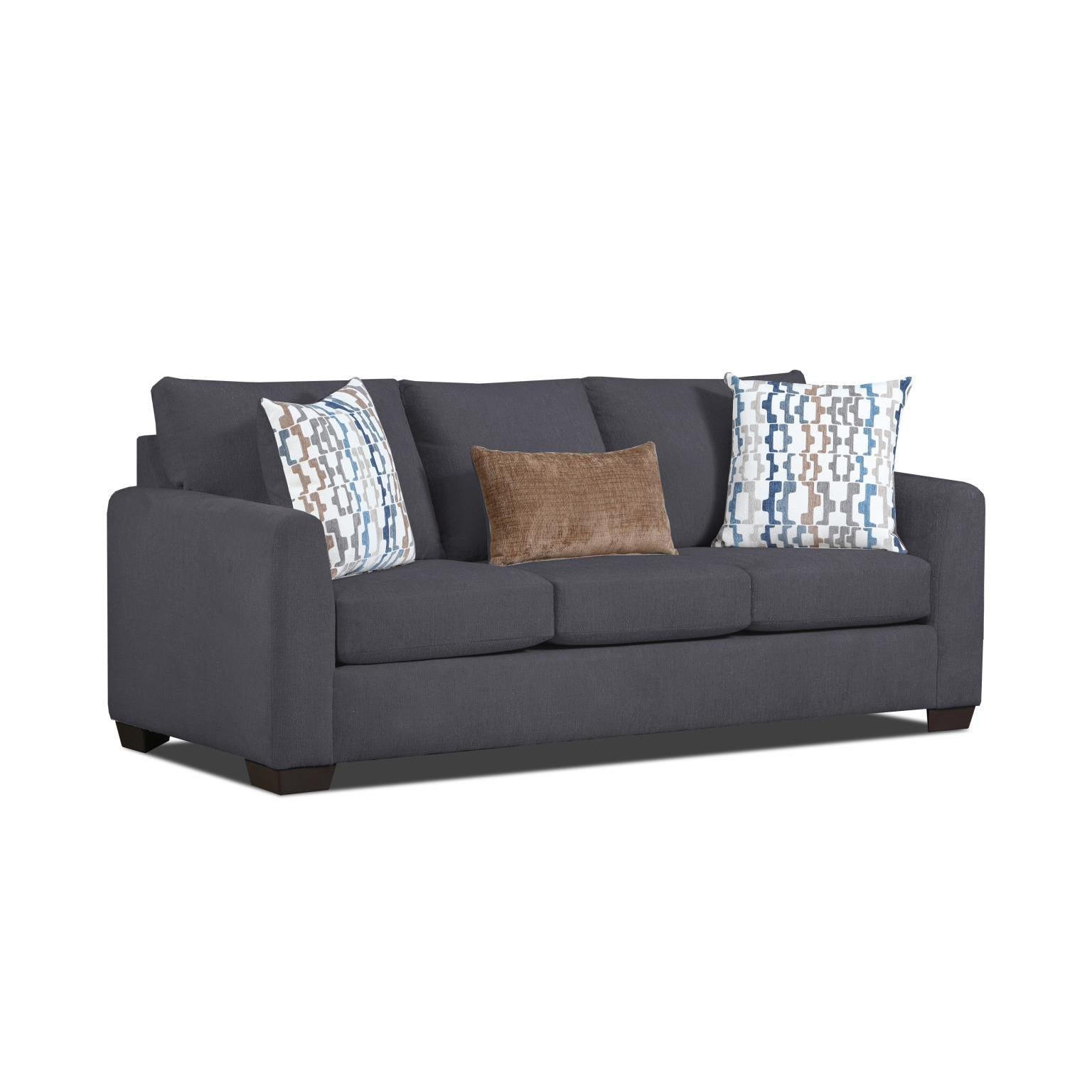 Dark gray sofa with three patterned accent pillows.