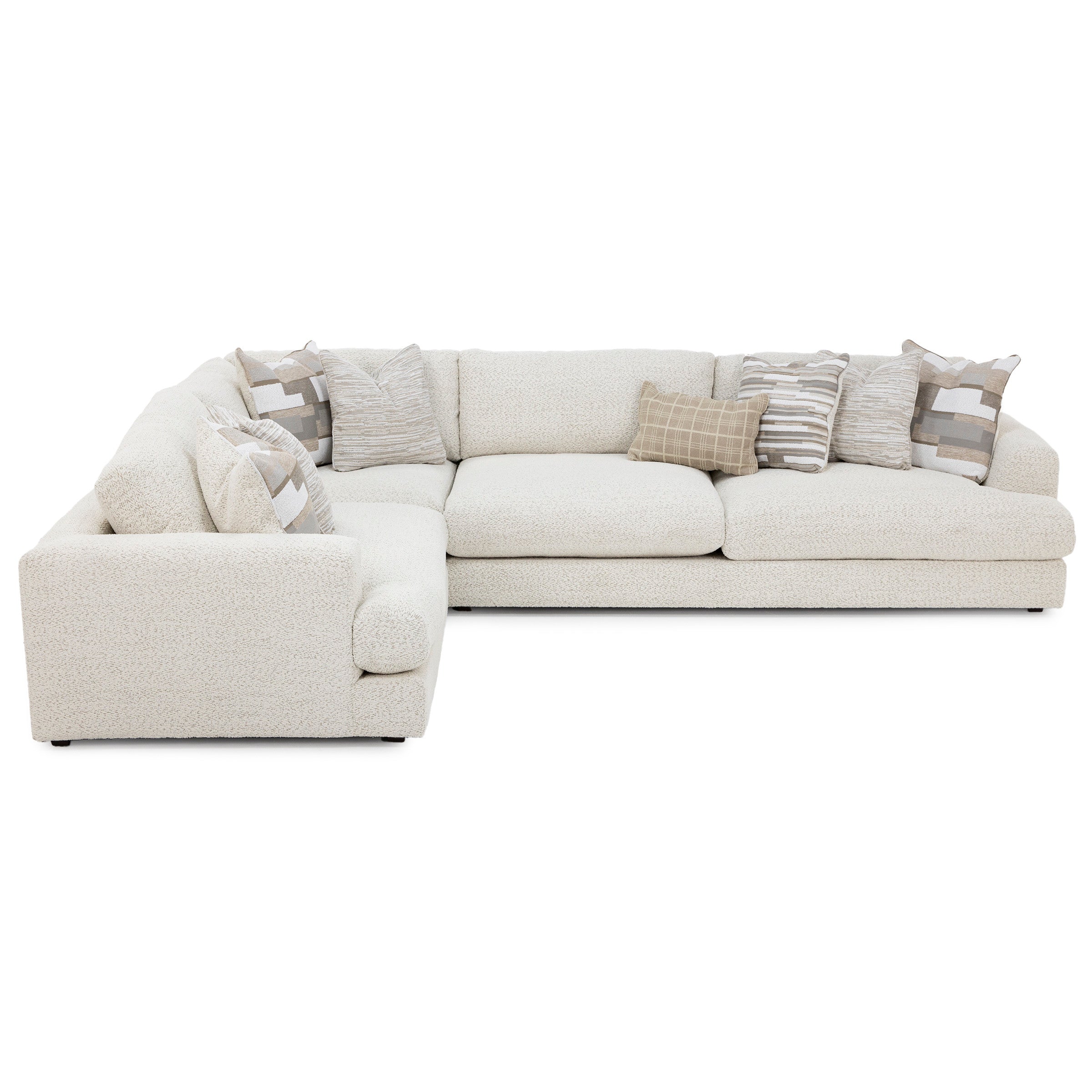 Modern cream sectional sofa with textured fabric and assorted neutral throw pillows.