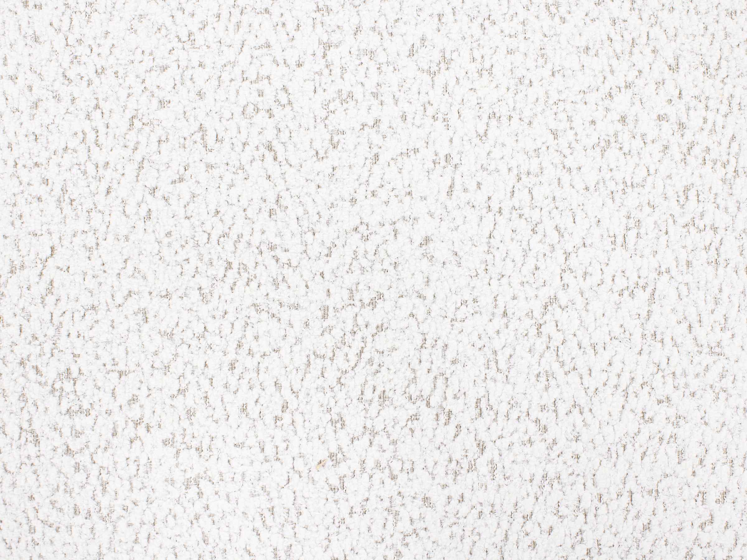 White textured surface with a subtle, irregular dotted pattern.