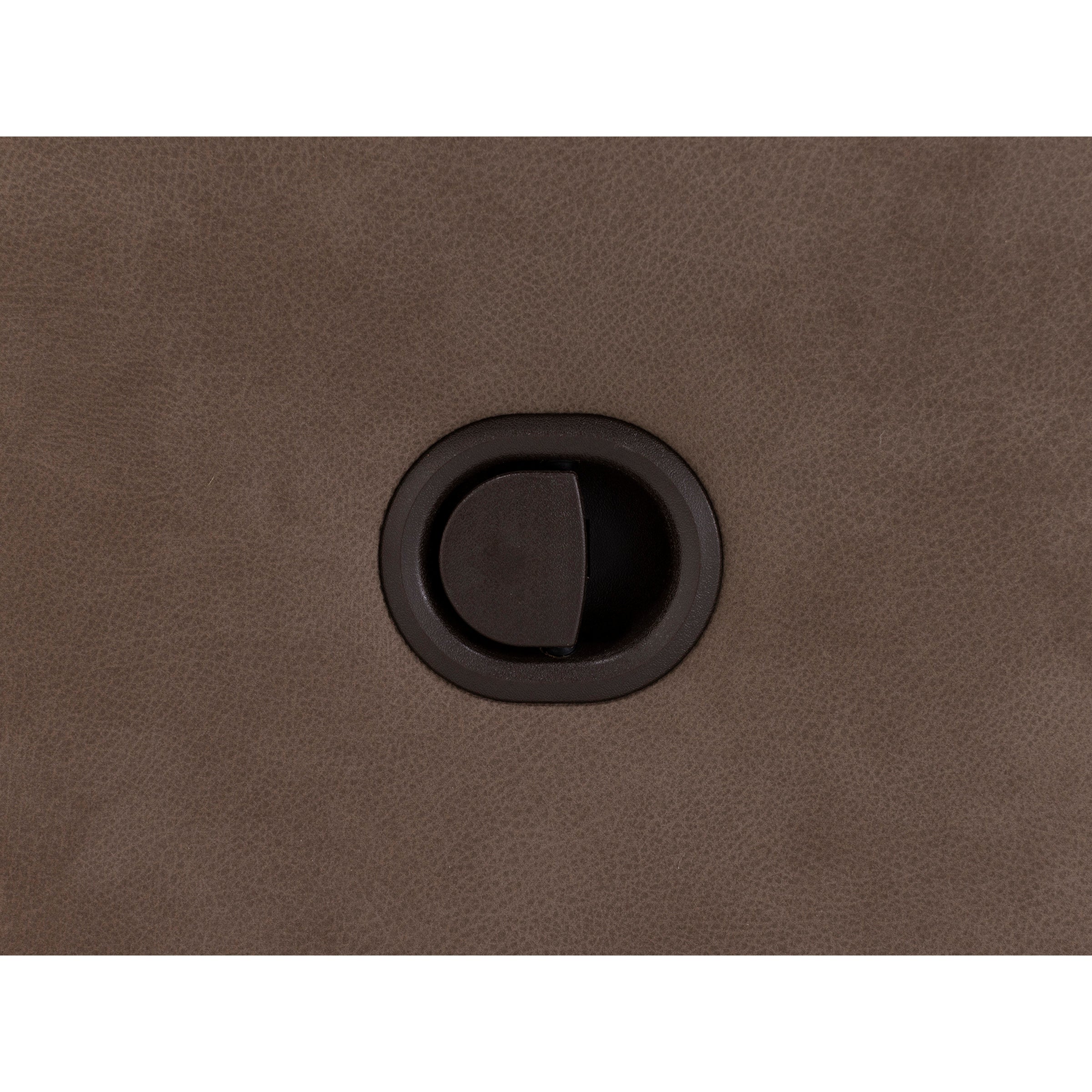 Round brown recliner release switch on textured fabric surface.