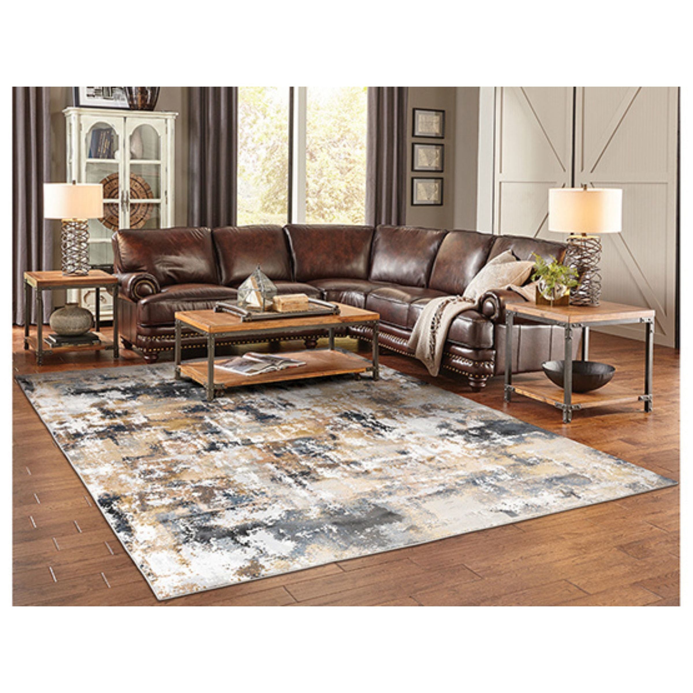 Modern living room with a brown leather sectional, abstract rug, and wood furniture.