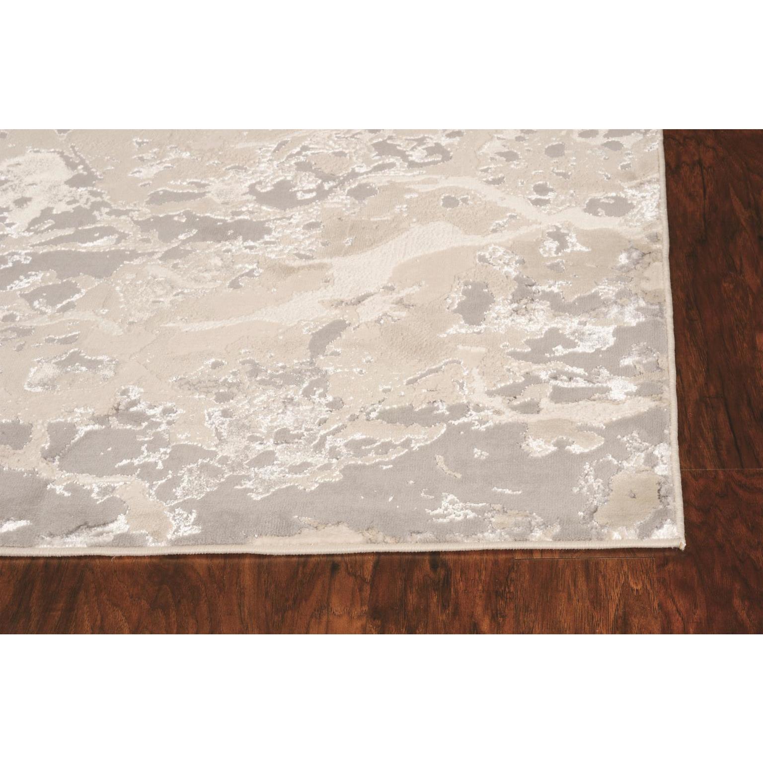 Beige and gray abstract area rug corner on hardwood floor