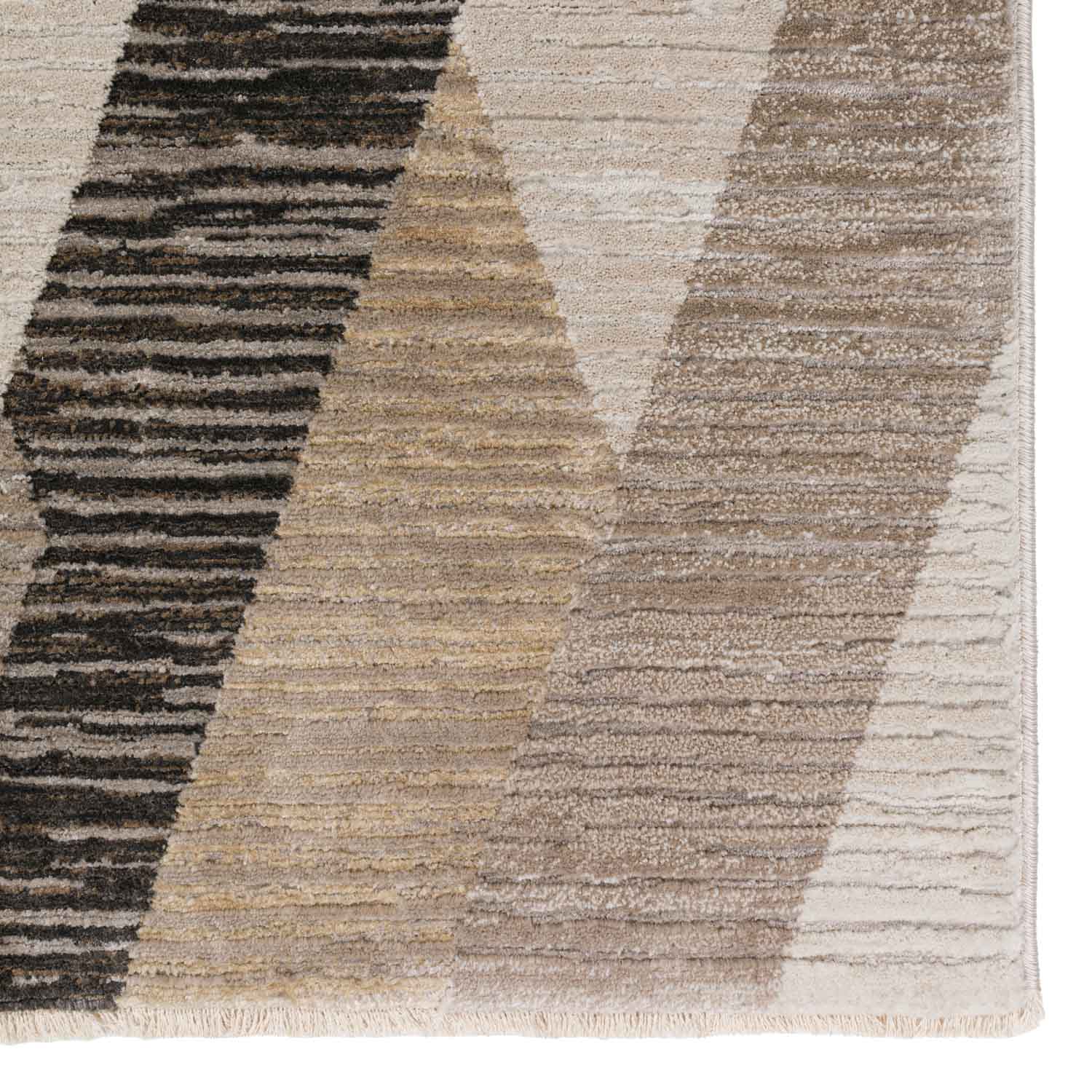 Close-up of a textured area rug with geometric stripes in neutral beige and brown tones.