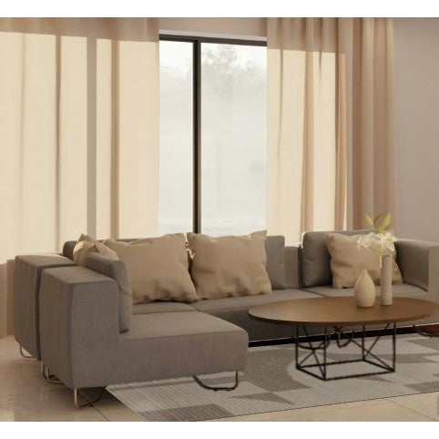 Modern living room with a grey sectional sofa, coffee table, and beige curtains.