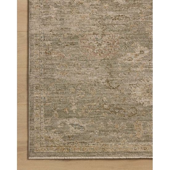 Neutral-toned area rug with subtle distressed pattern on wood floor.
