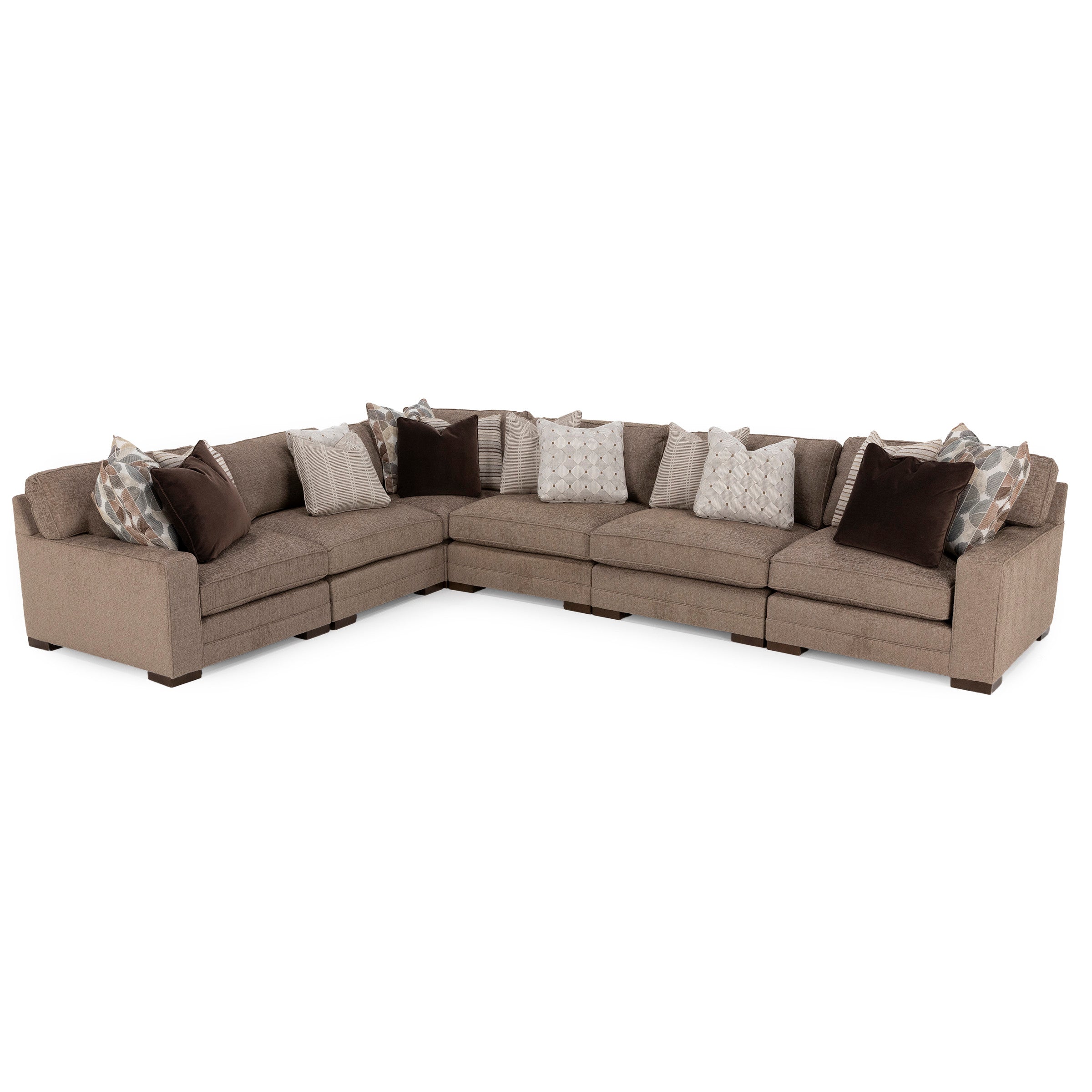 Large L-shaped sectional sofa in brown fabric with assorted throw pillows.
