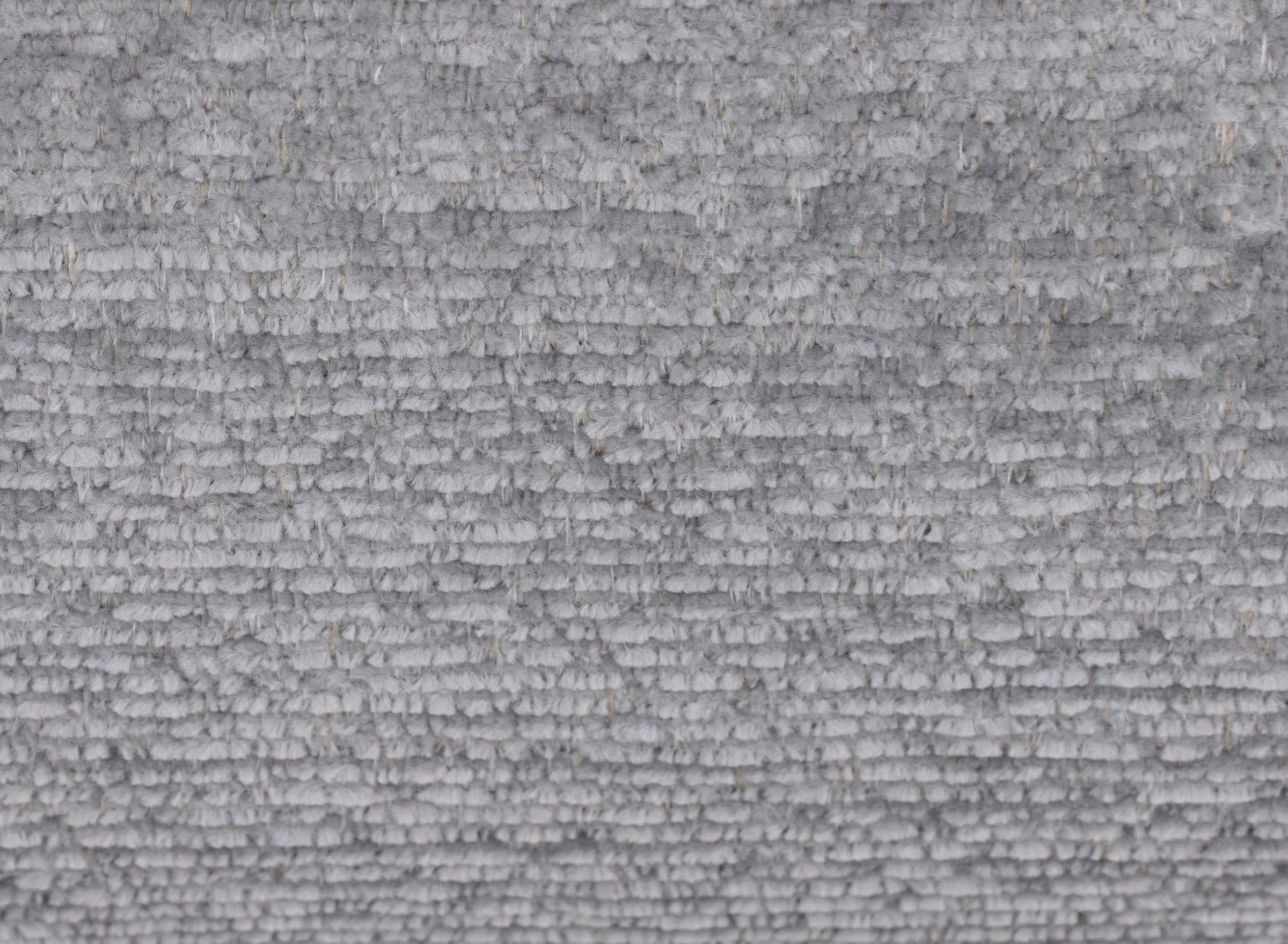 Close-up of light gray textured fabric.