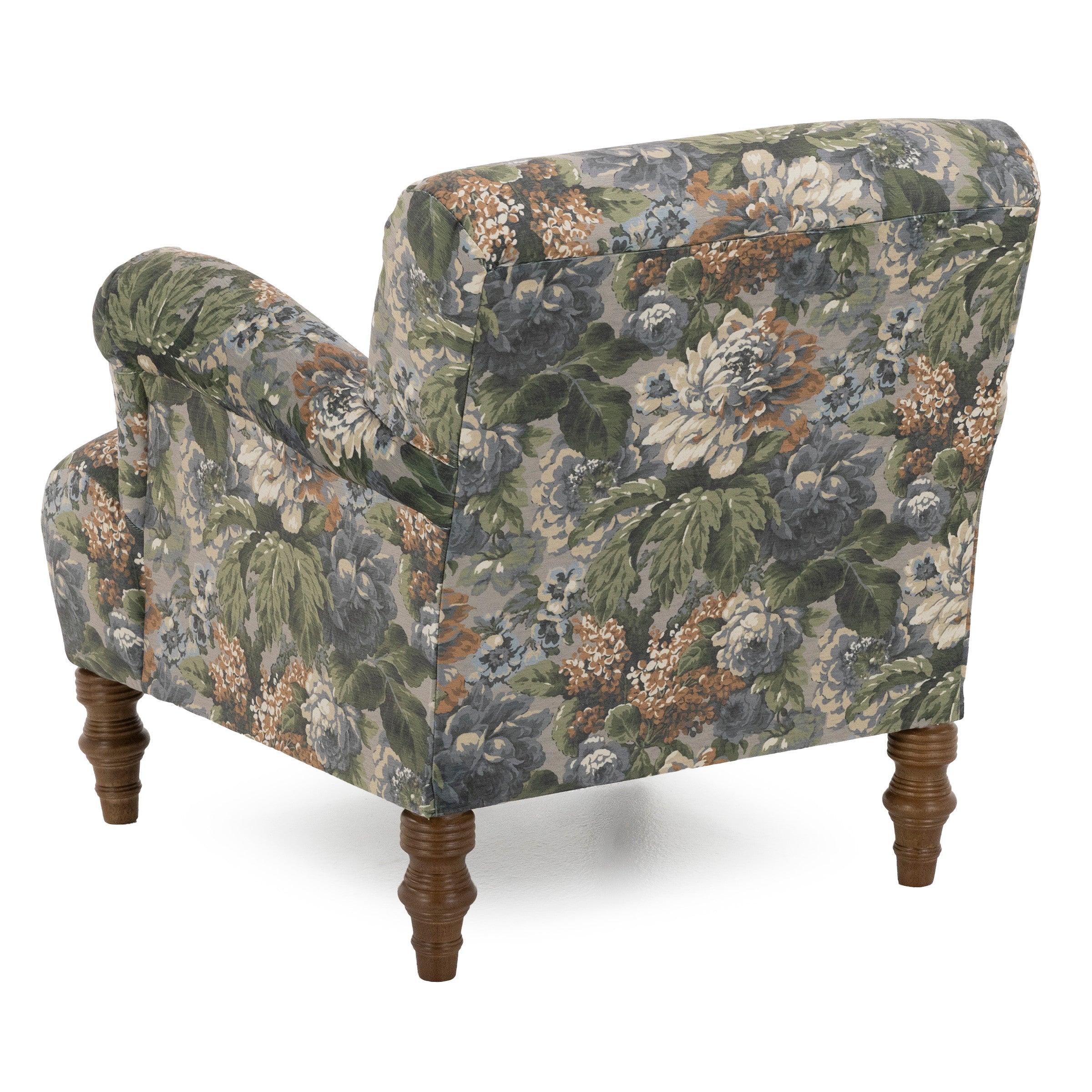 Armchair with dark floral upholstery and wooden legs, viewed from the back angle.