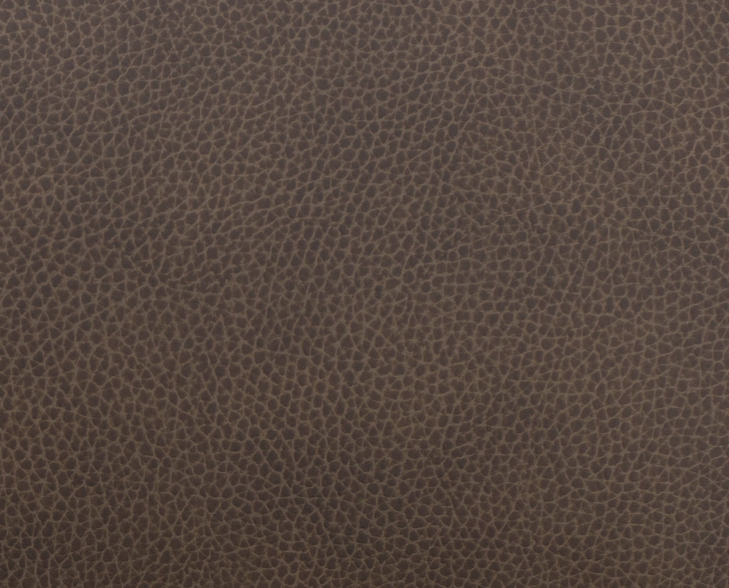 Close-up of brown textured leather material.