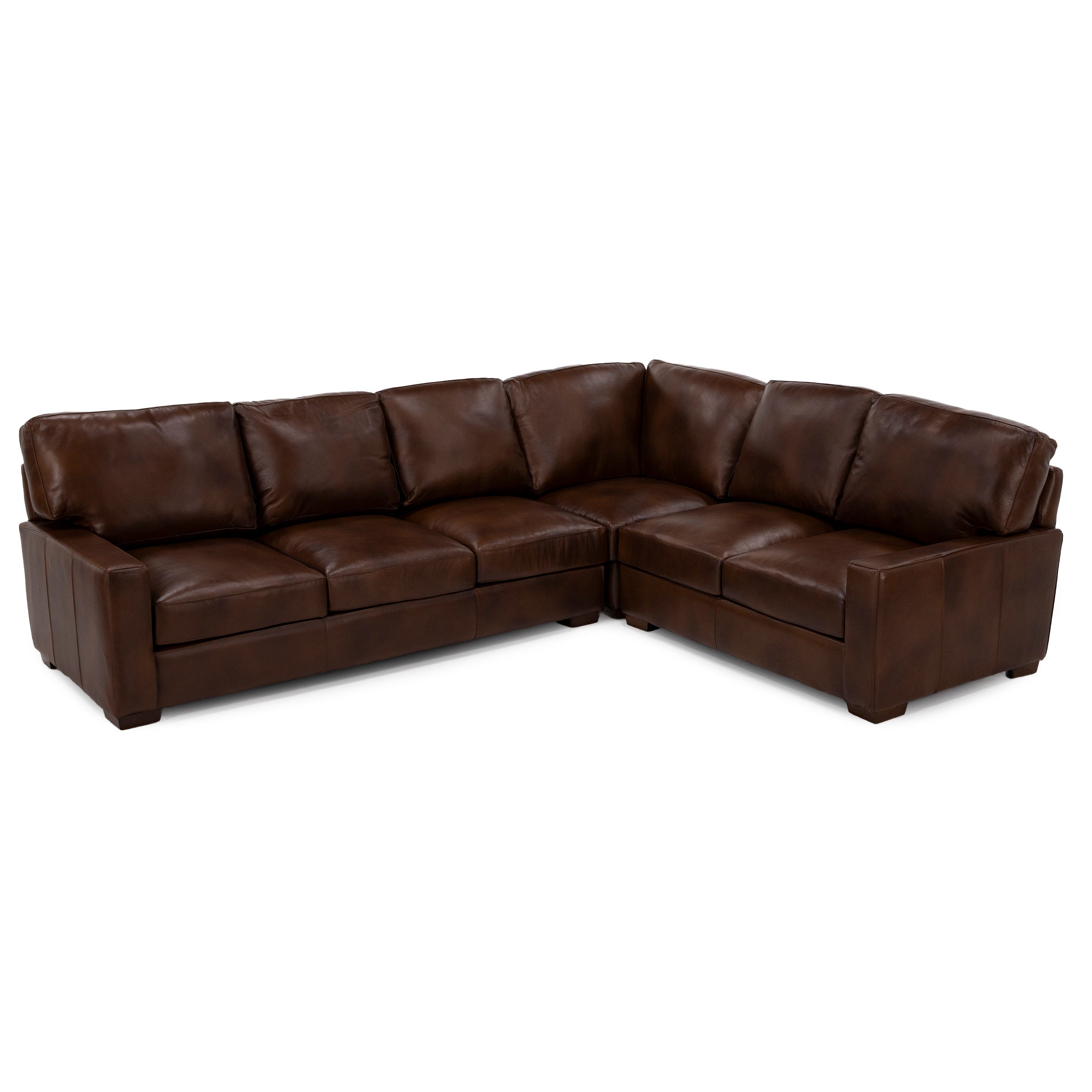 Brown leather L-shaped sectional sofa with wide seat cushions and plush back pillows.