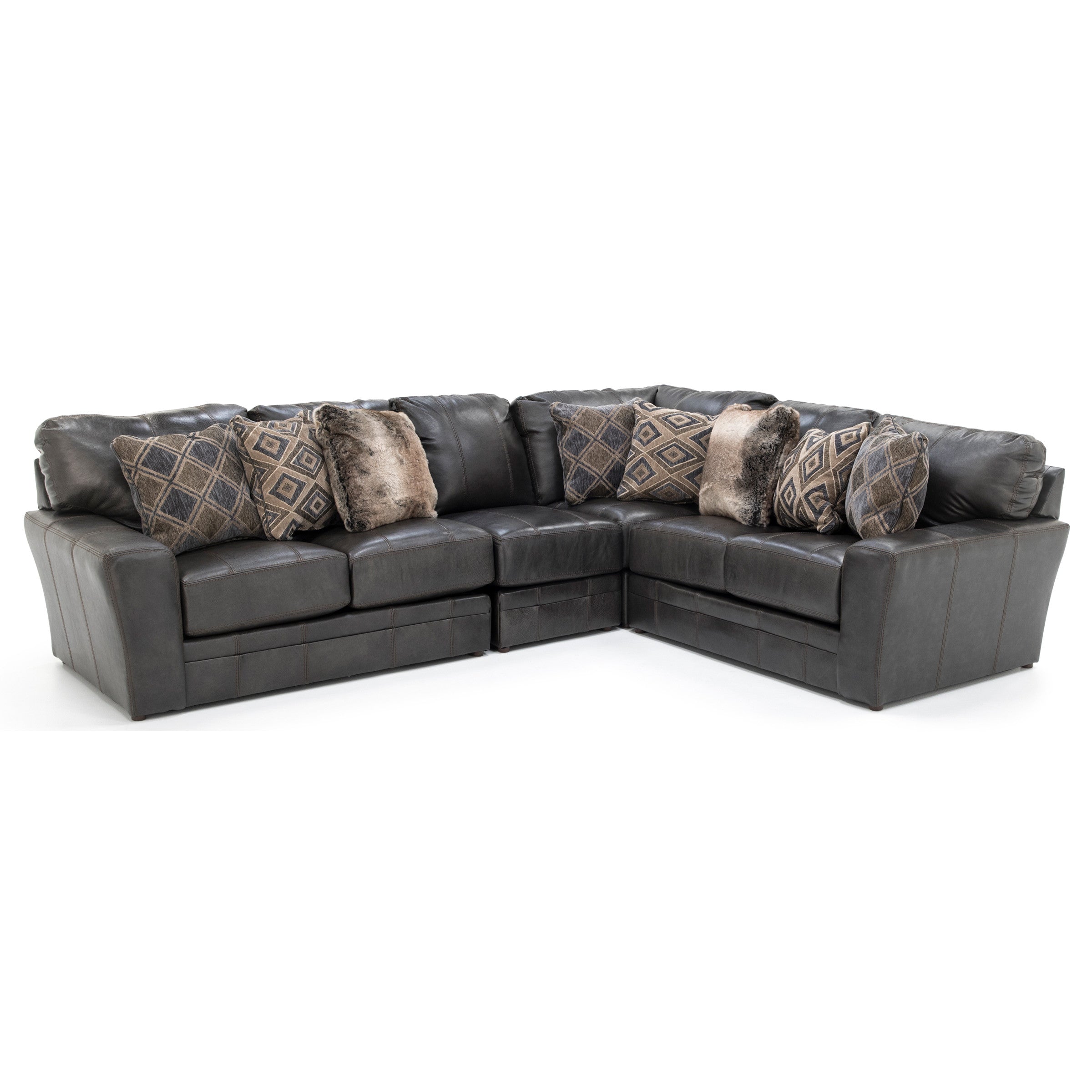 Dark gray leather sectional sofa with patterned and faux fur throw pillows.