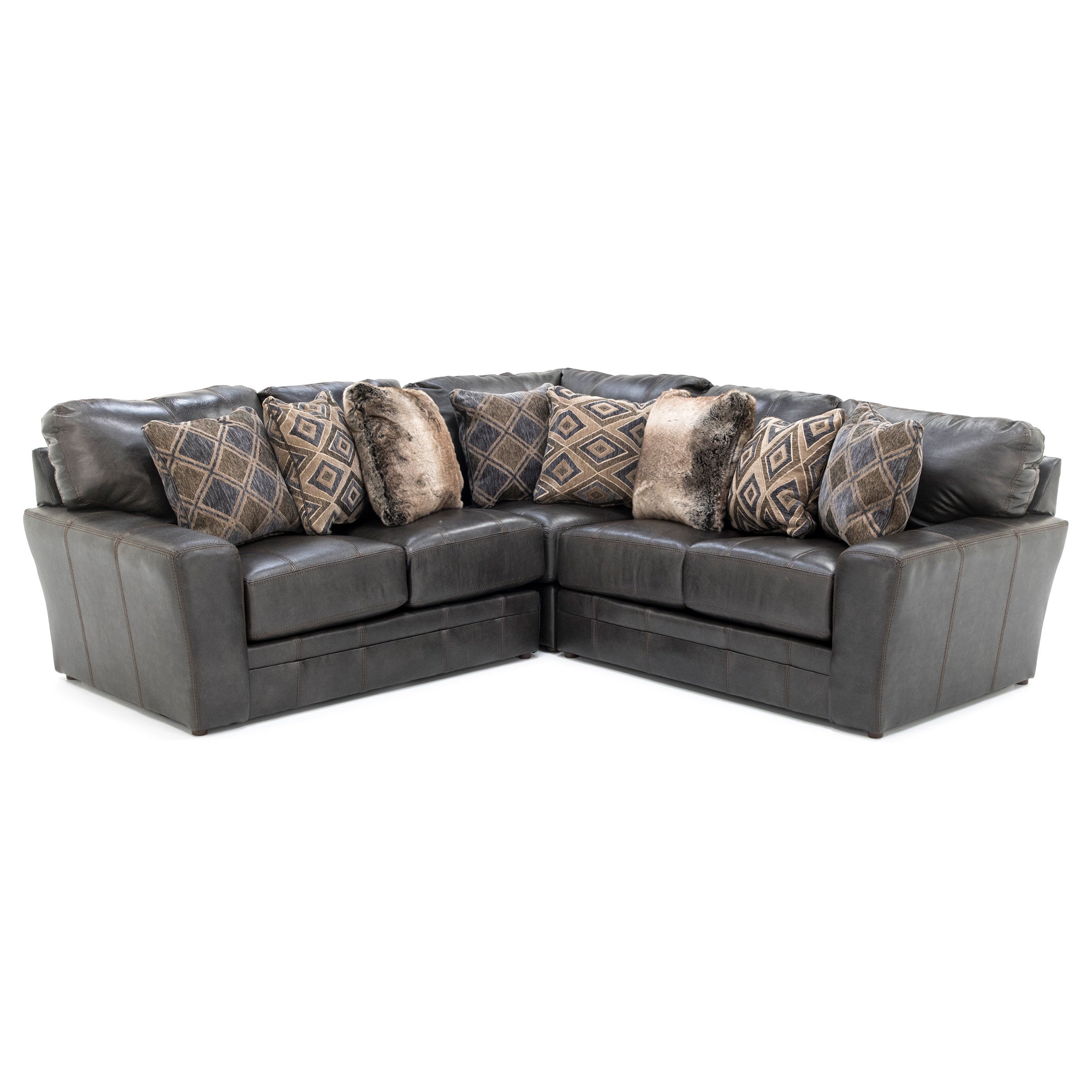 Dark gray L-shaped sectional sofa with assorted patterned and faux fur throw pillows.