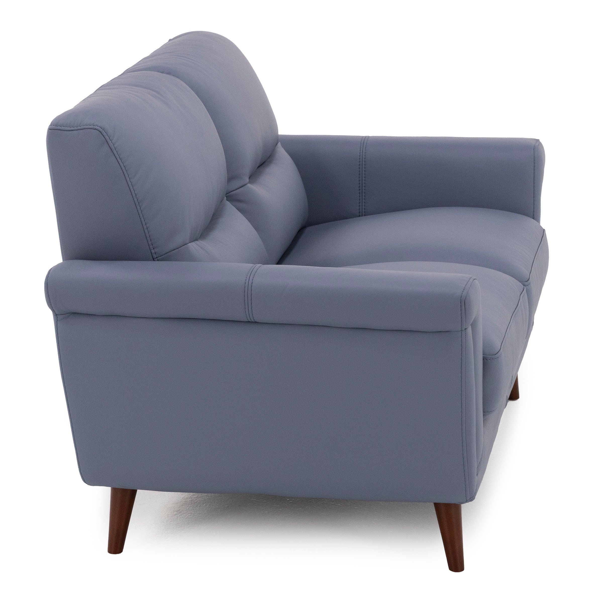 Side view of a modern blue armchair with wooden legs.