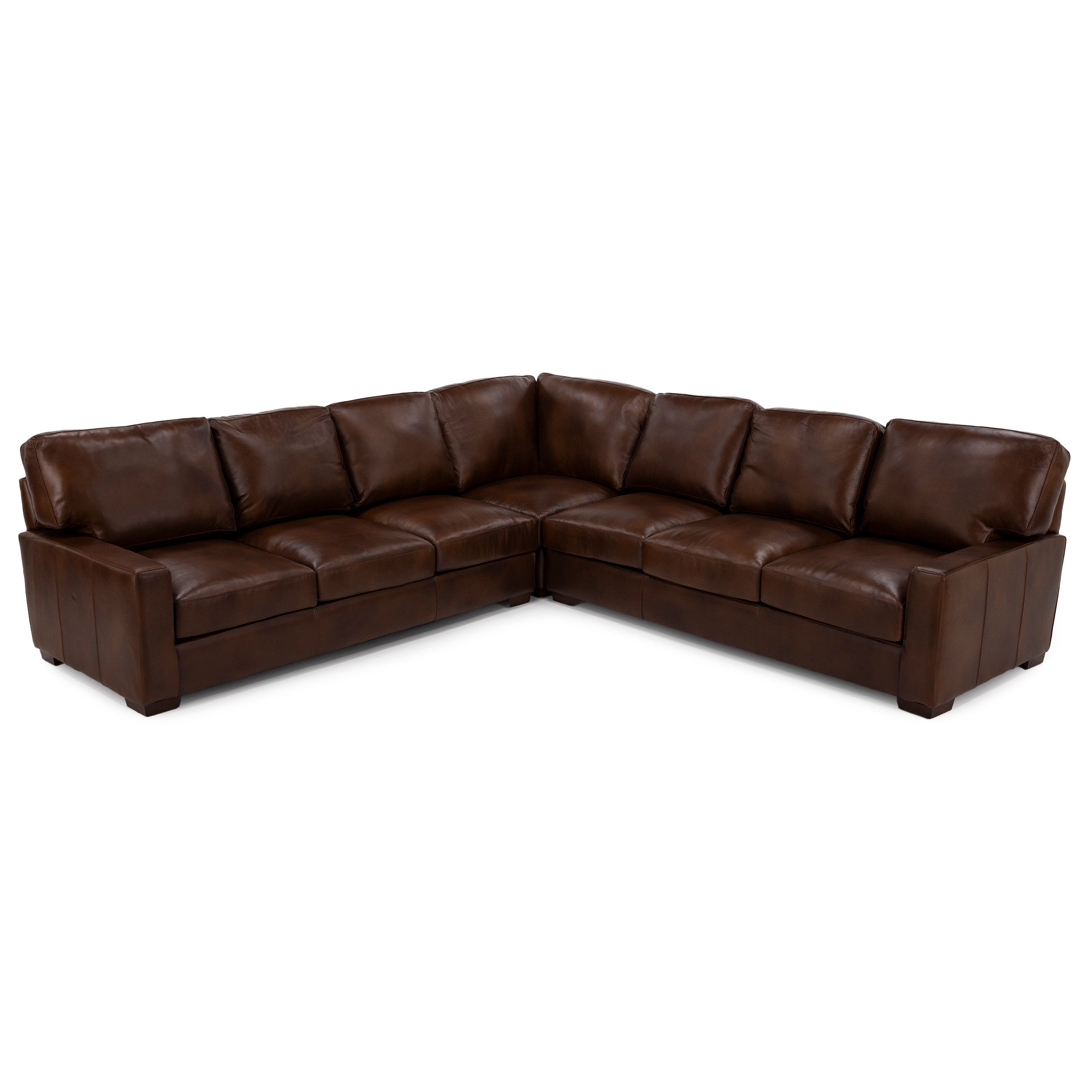 Brown leather sectional sofa with wide cushions and modern design.