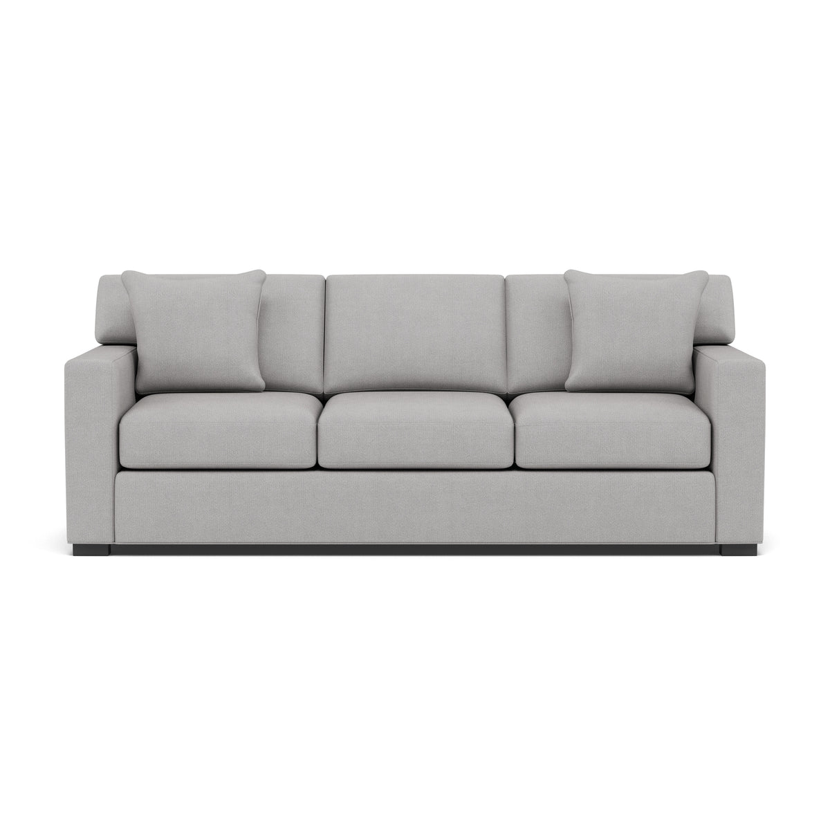 Light gray upholstered sofa with three seat and back cushions, two matching pillows, and square arms.
