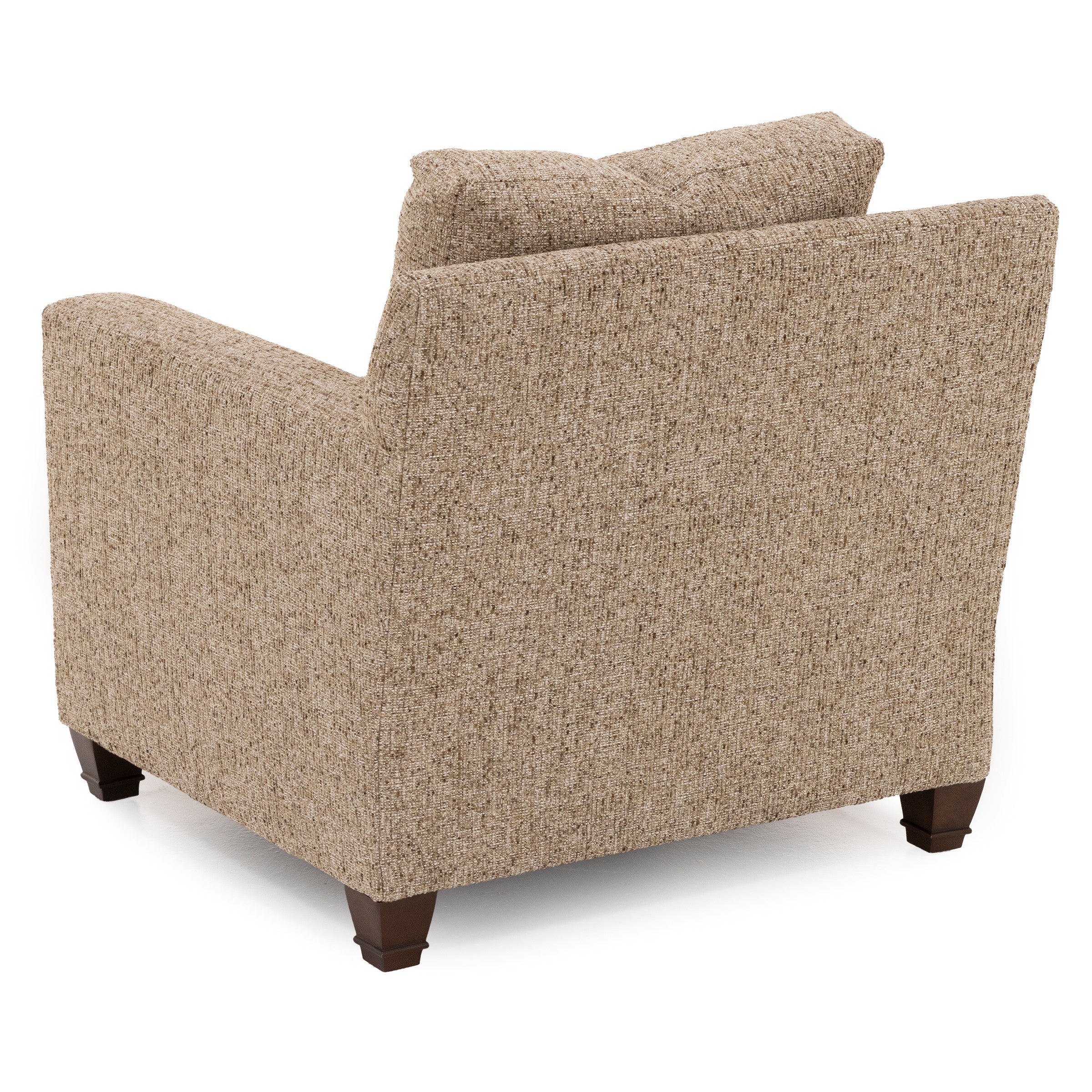 Back view of a beige upholstered armchair with wooden legs.