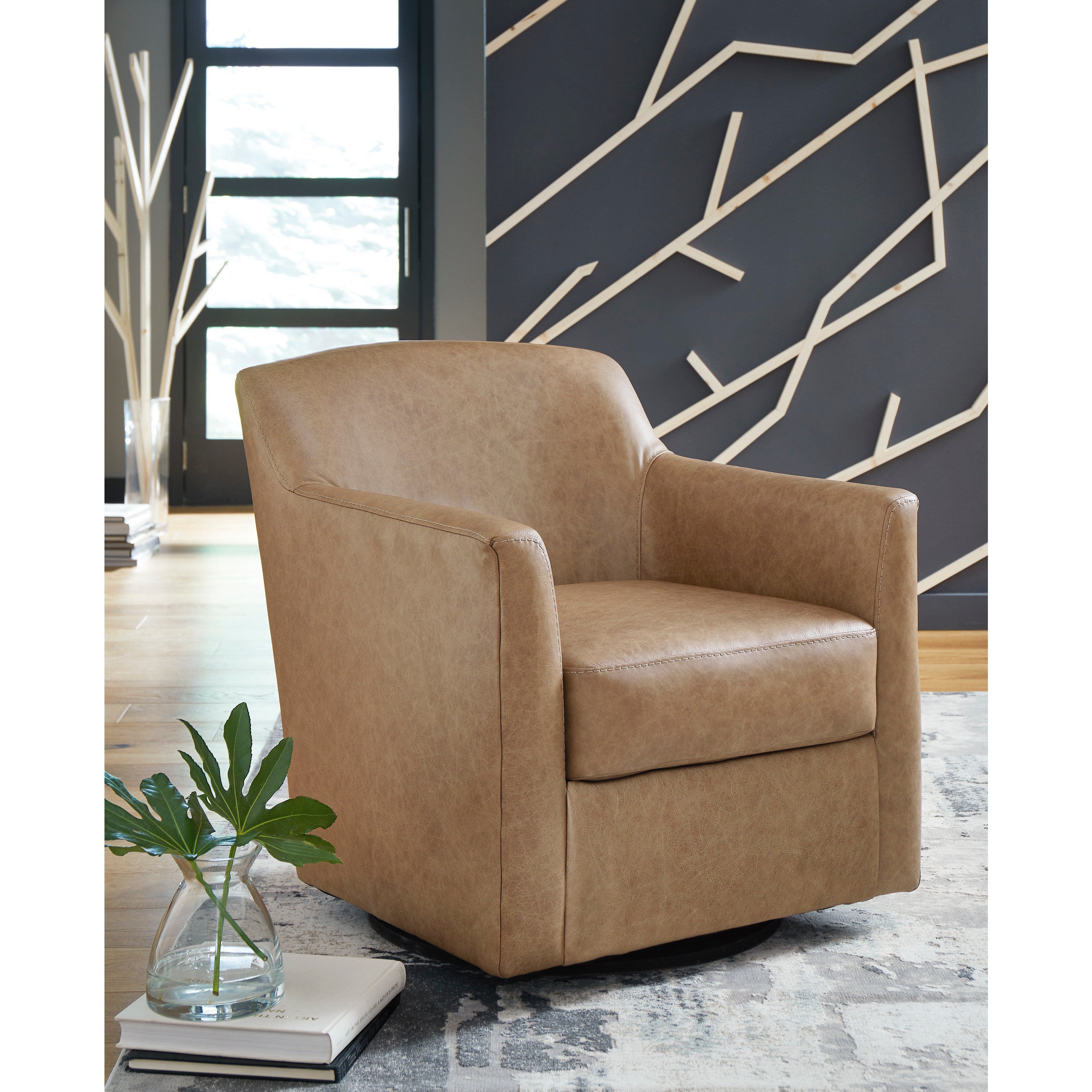 Tan swivel accent chair in a modern living room.