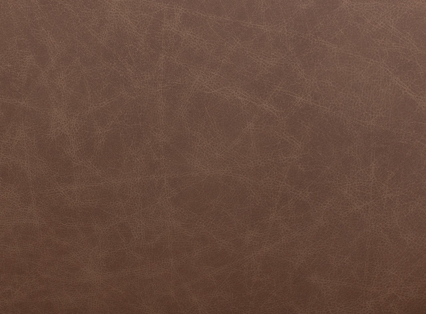 Close-up of brown distressed leather texture.