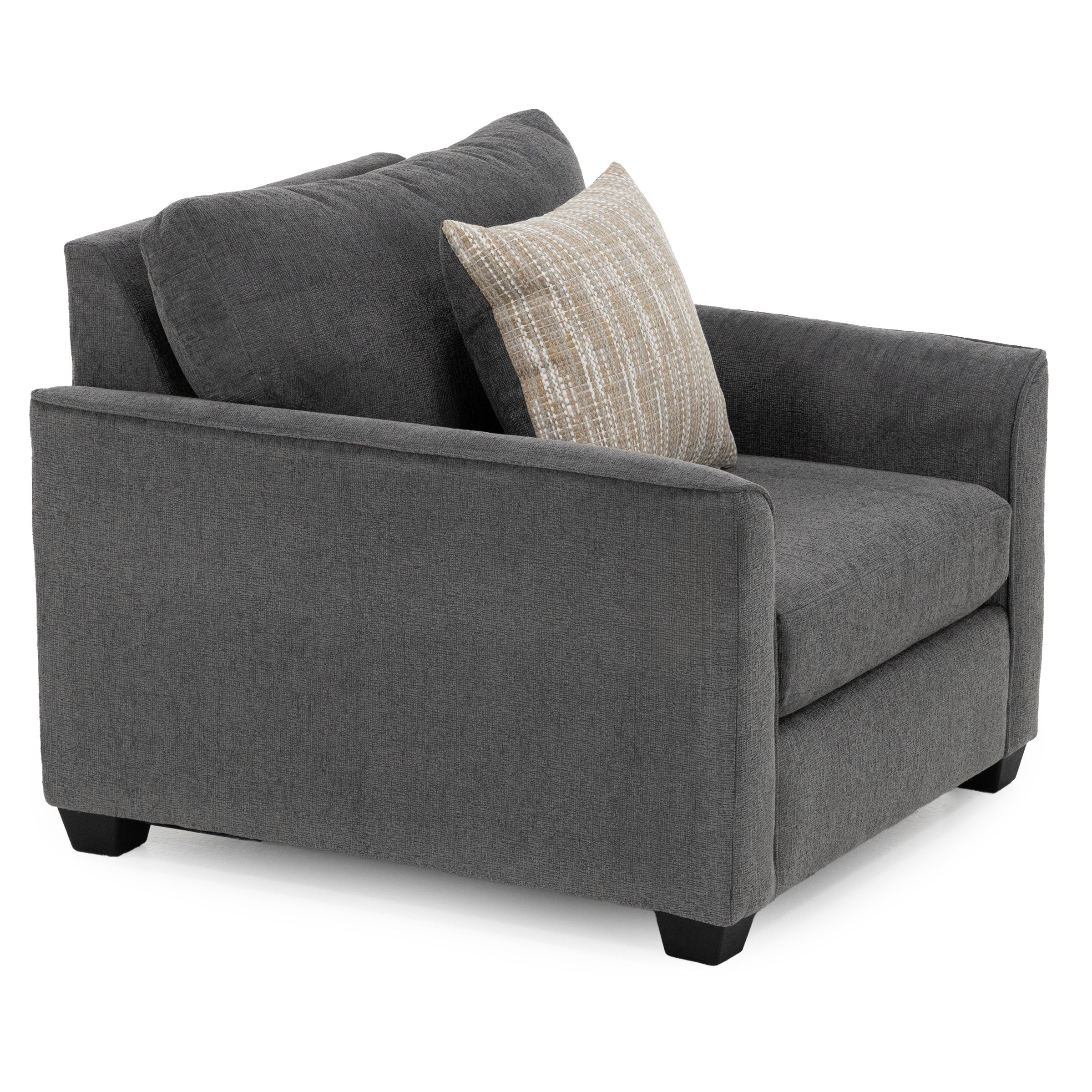 Dark gray armchair with a beige patterned accent pillow.