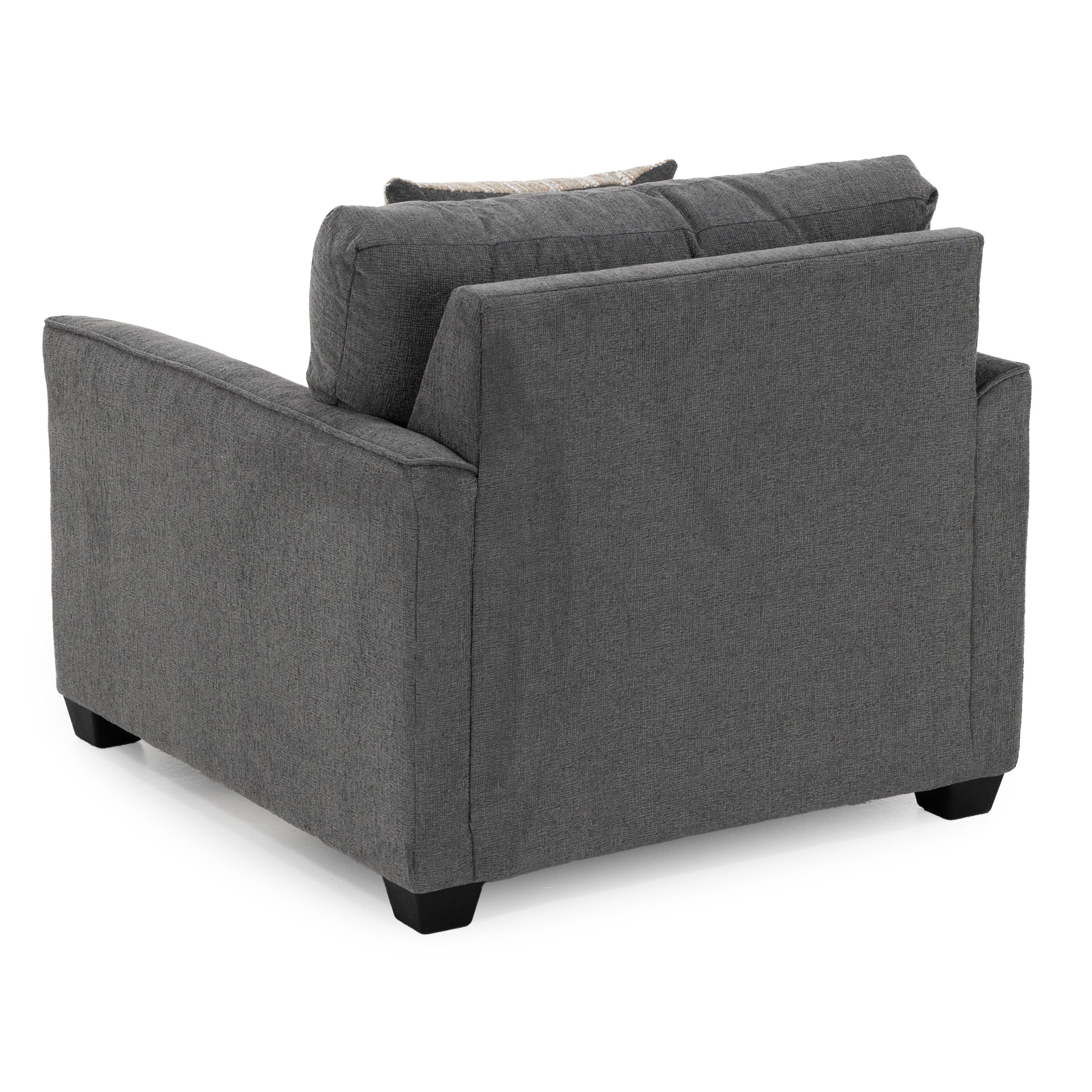 Back view of a modern, dark gray upholstered armchair with square arms and short black legs.