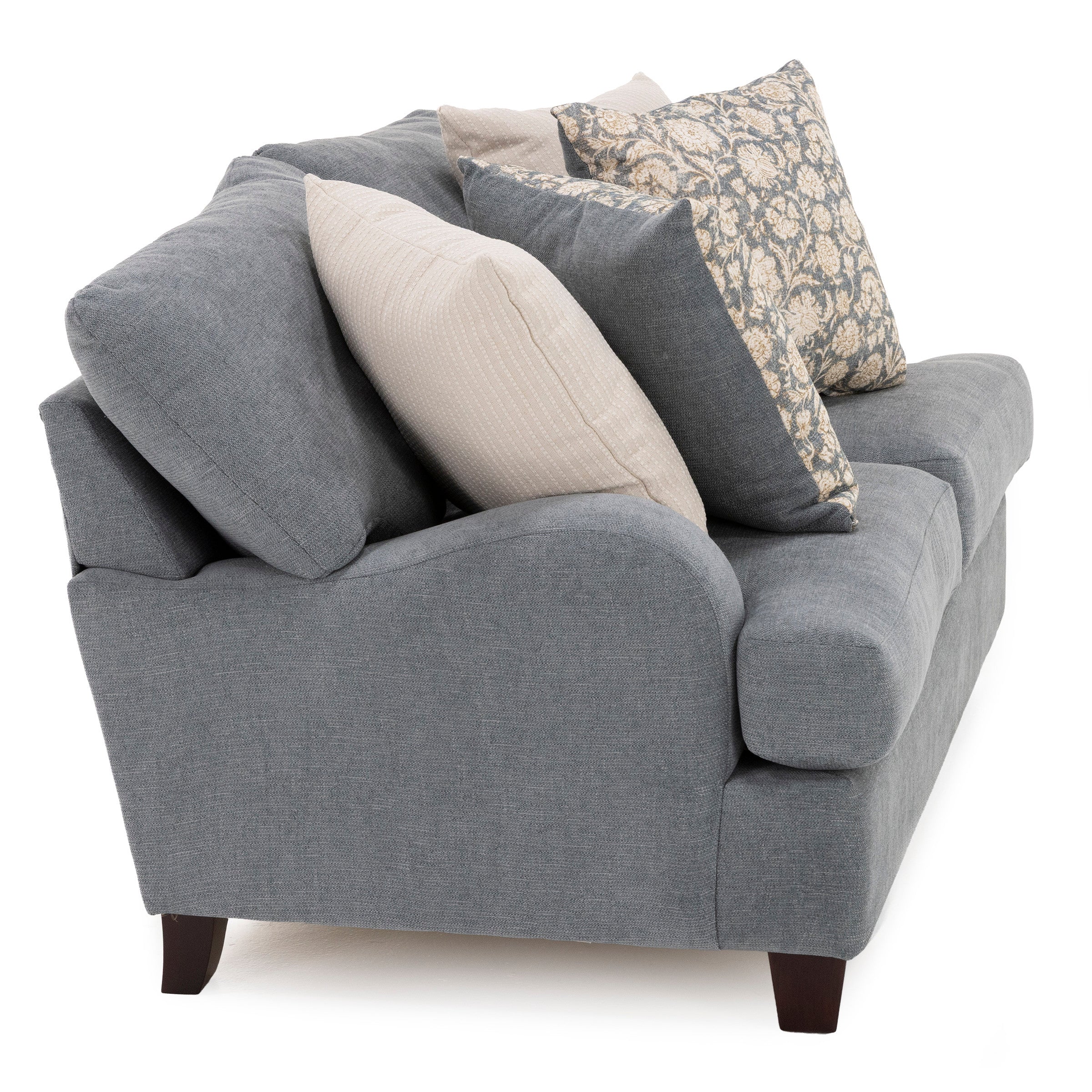 Gray upholstered loveseat with four decorative throw pillows.