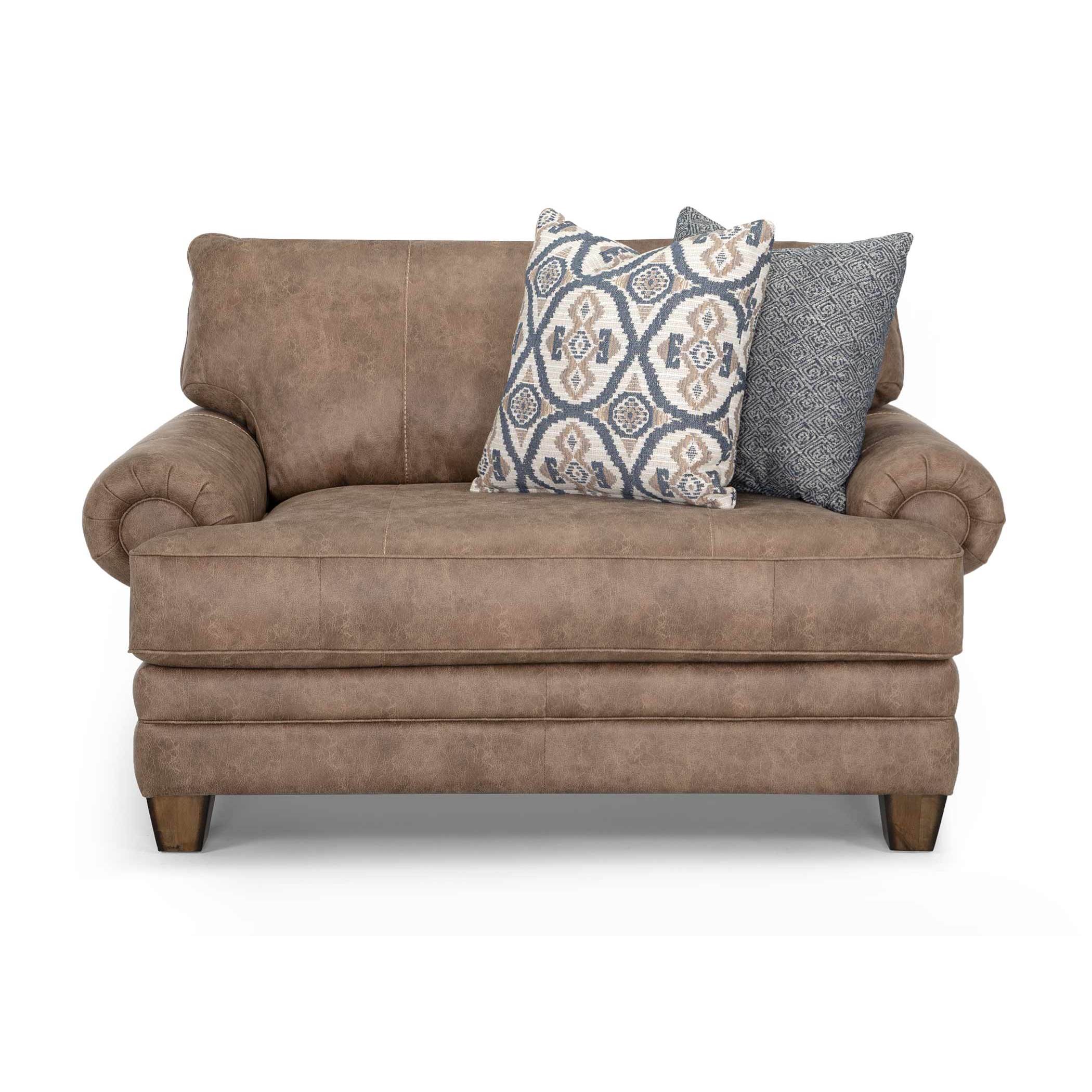 Brown upholstered loveseat with two decorative pillows.